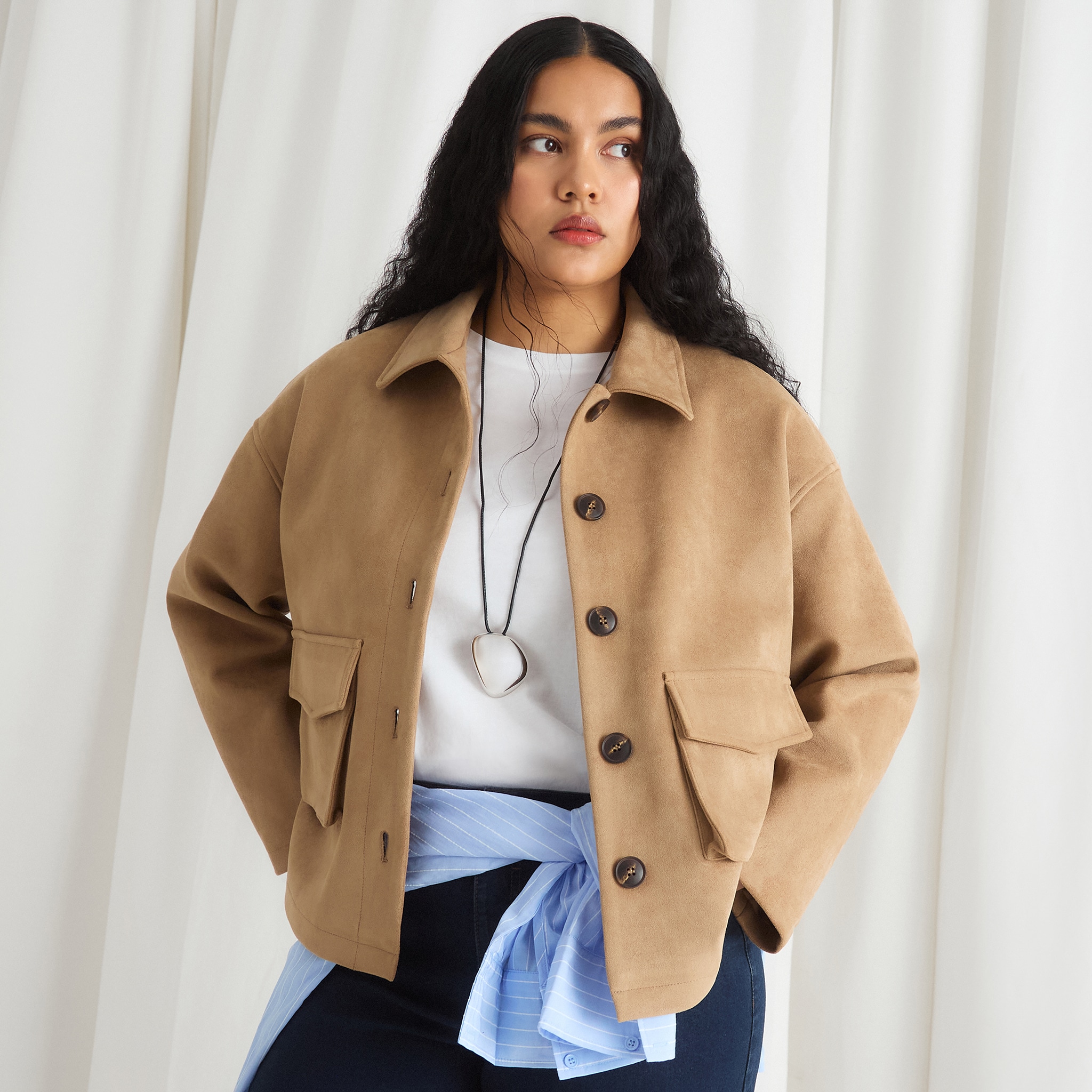 Model wears Simply Be Tan Suedette Pocket Shacket our white top