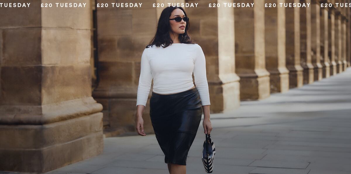 Model wears new season white top and black skirt