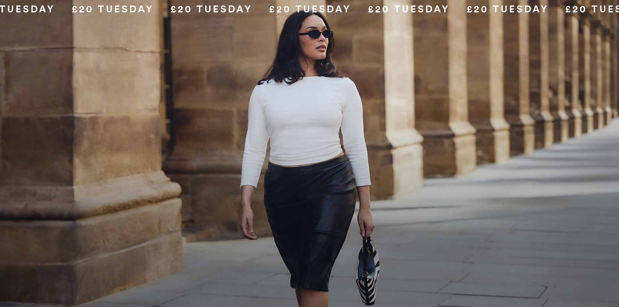 Model wears new season white top and black skirt