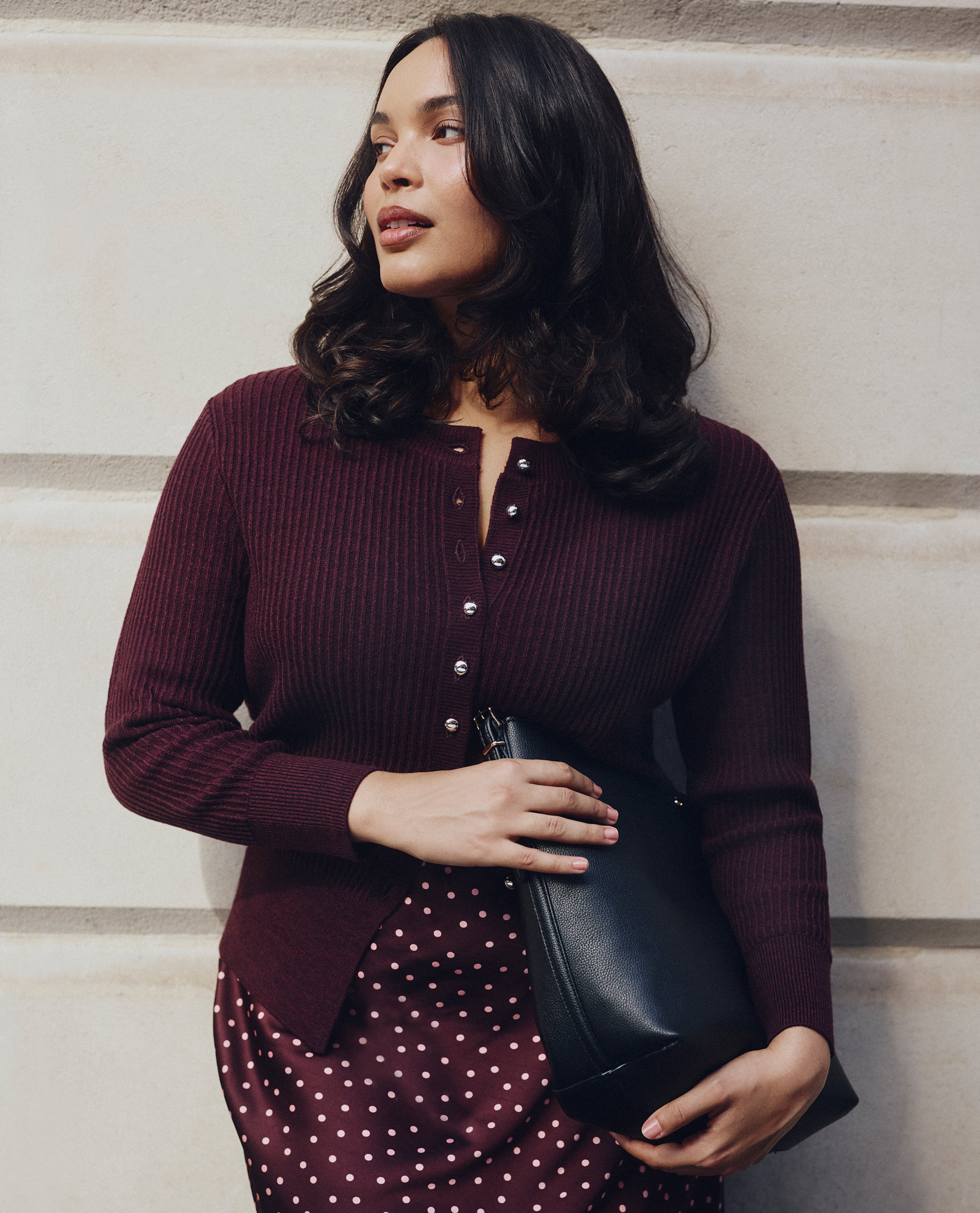 Model wears new season cardigan in deep red