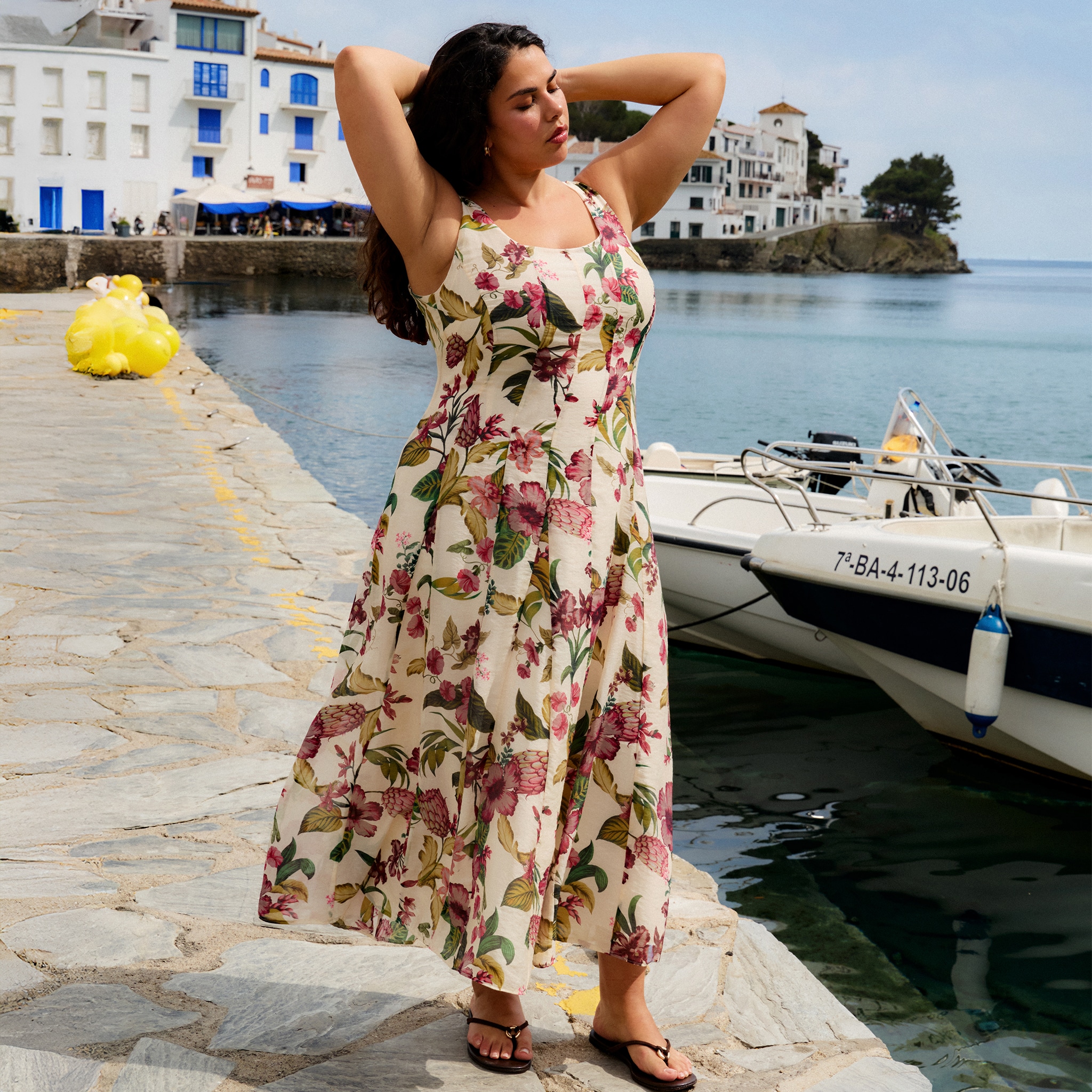 Model wears floral print dress