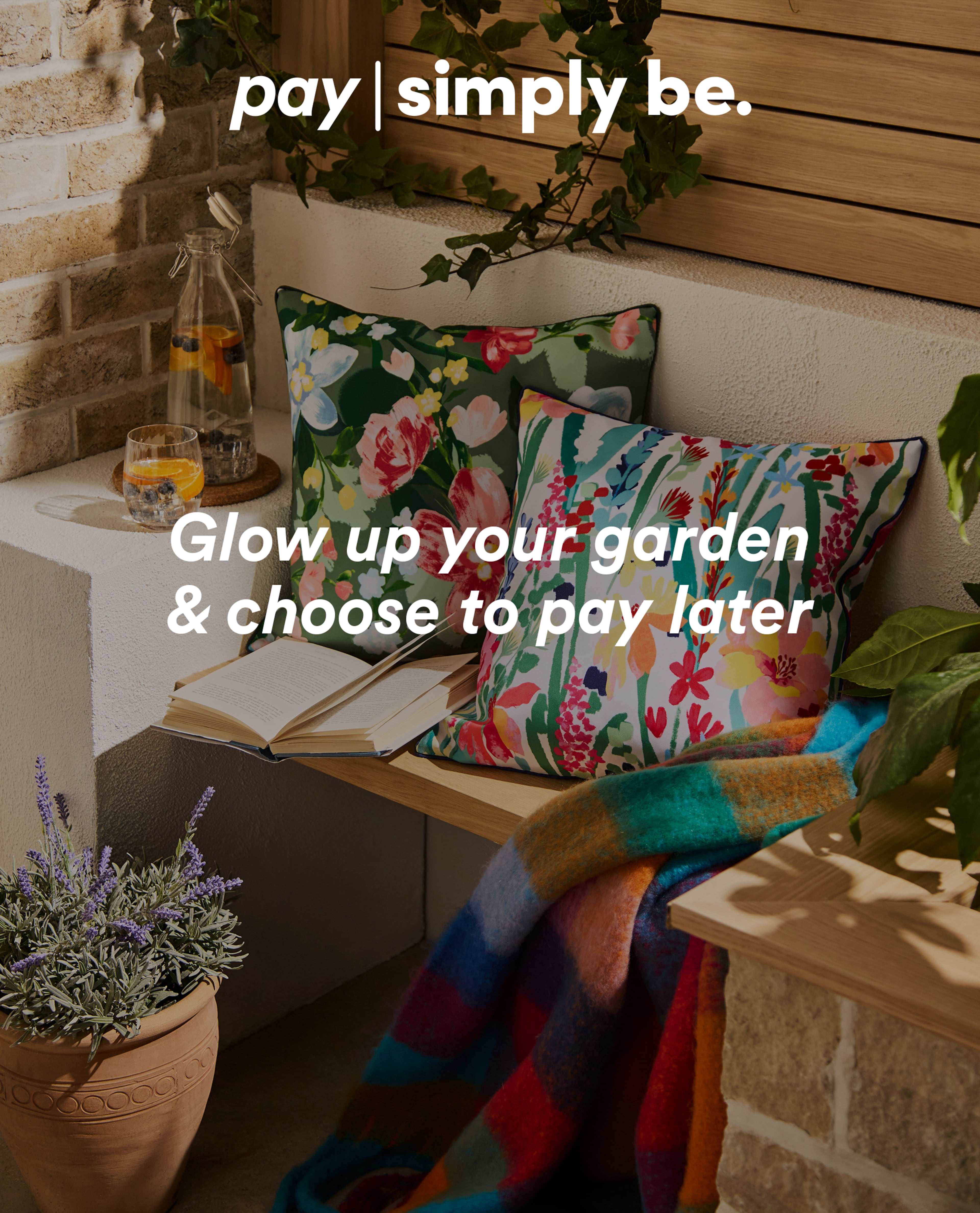 Outdoor garden seating with floral cushions, a colourful throw, and a pay-later promotion.