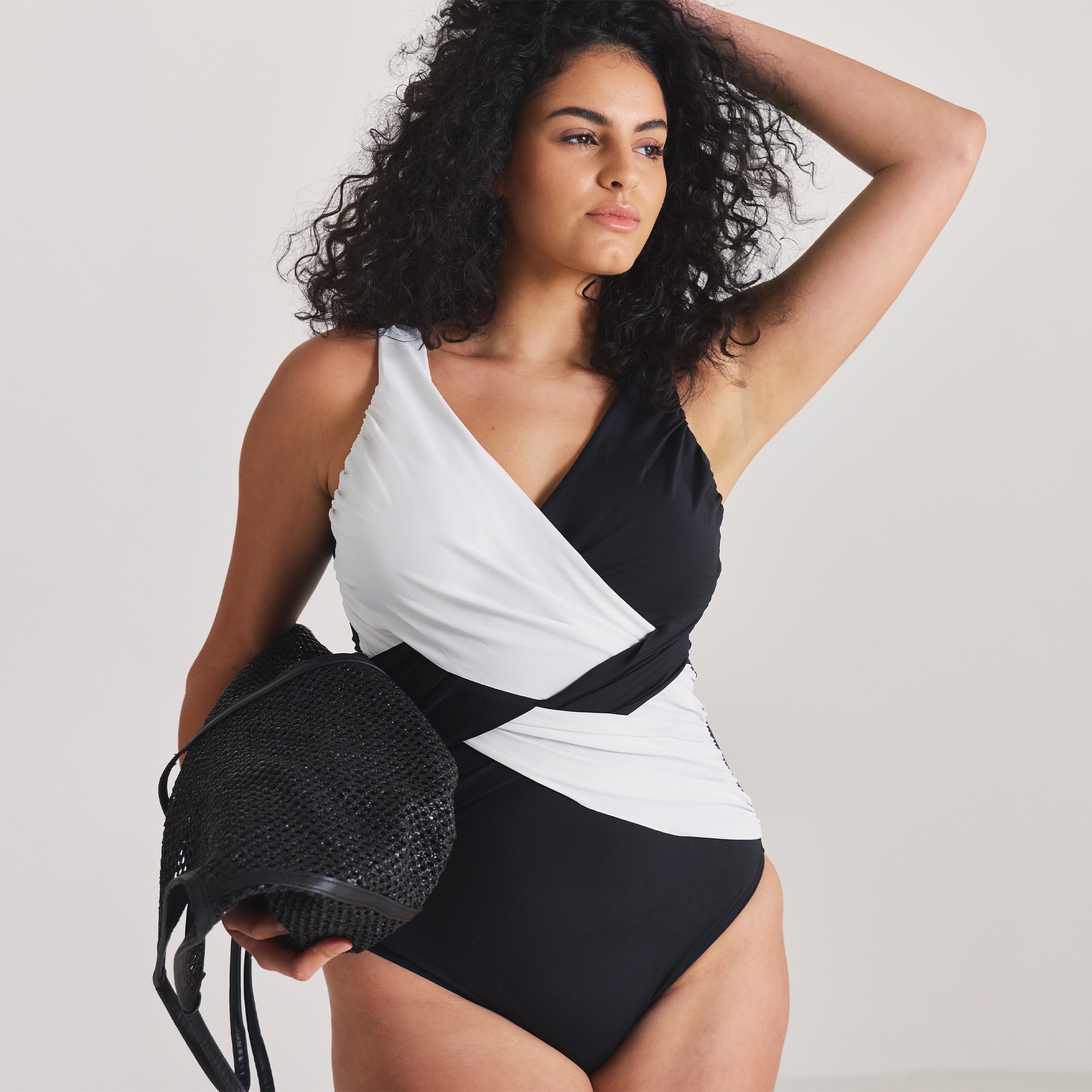 model wearing shapewear swimwear black and white