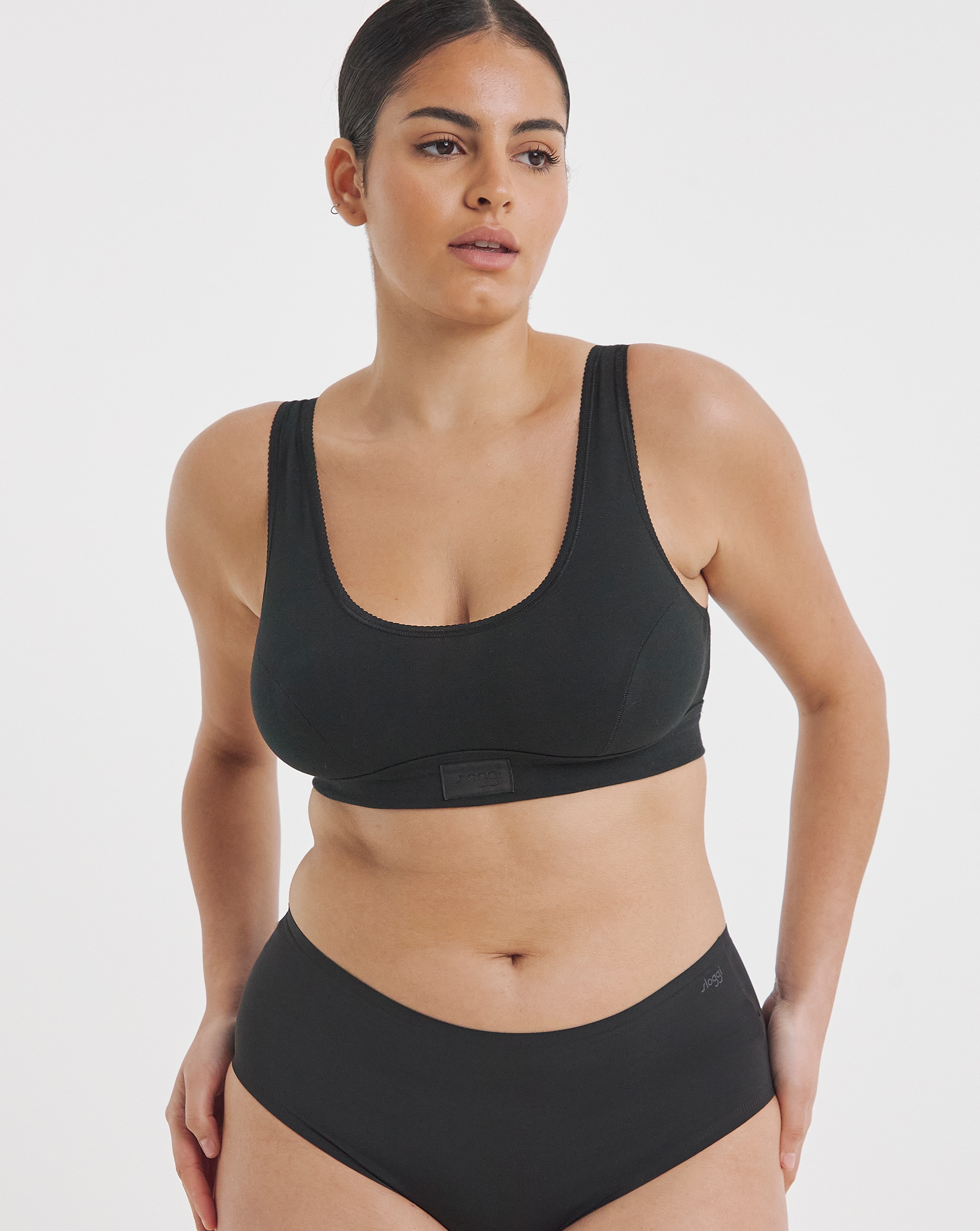 model wearing sloggi black underwear