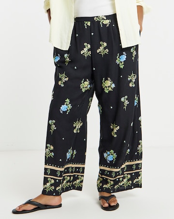 Simply Be Black Floral Border Print Wide Leg Trousers