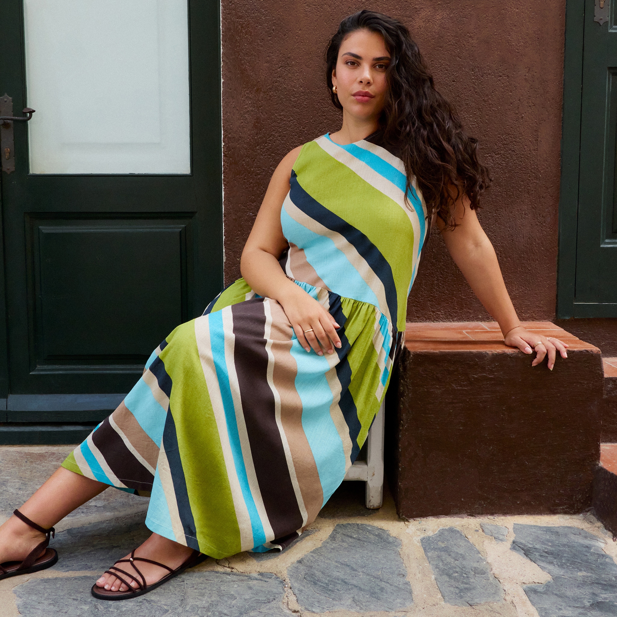 Model wears multi-coloured striped dress