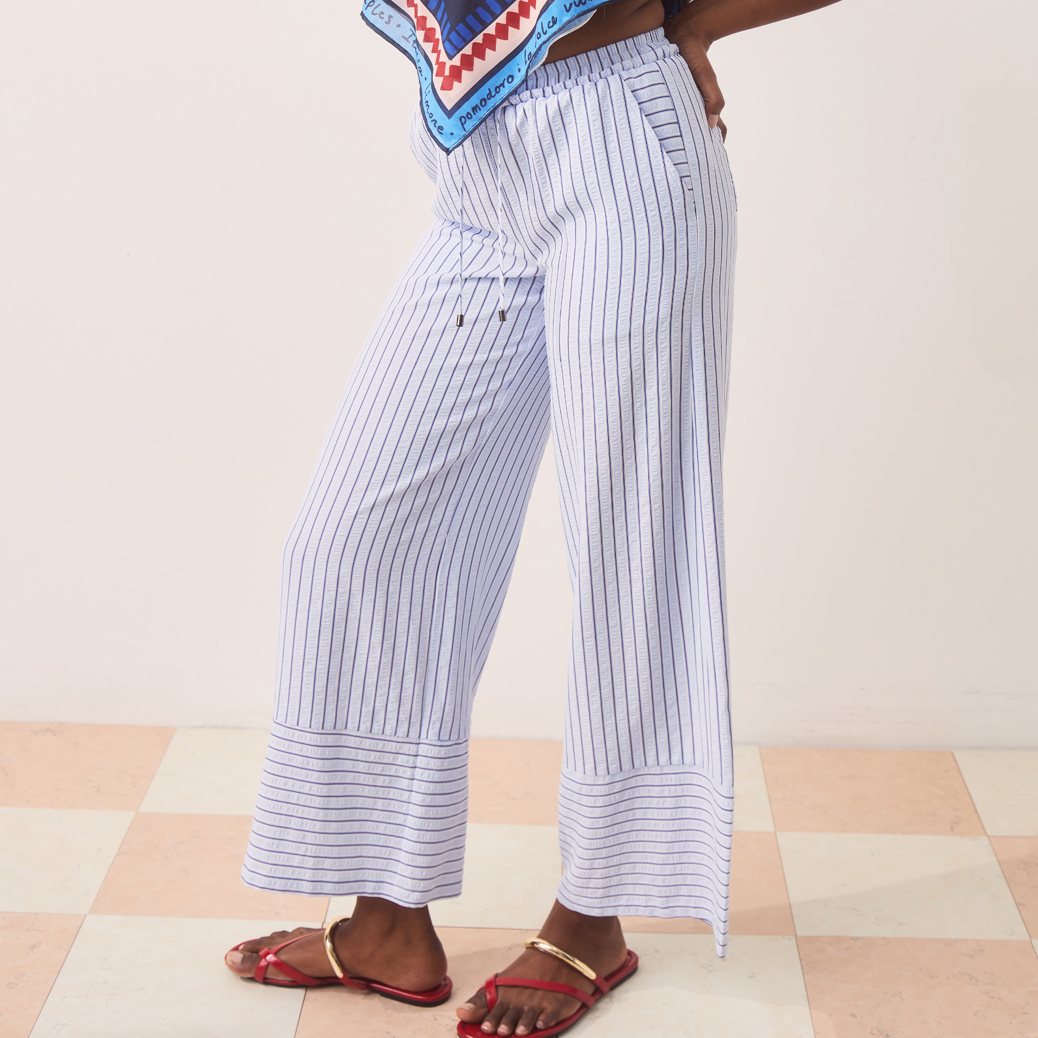 model wearing trousers blue and white