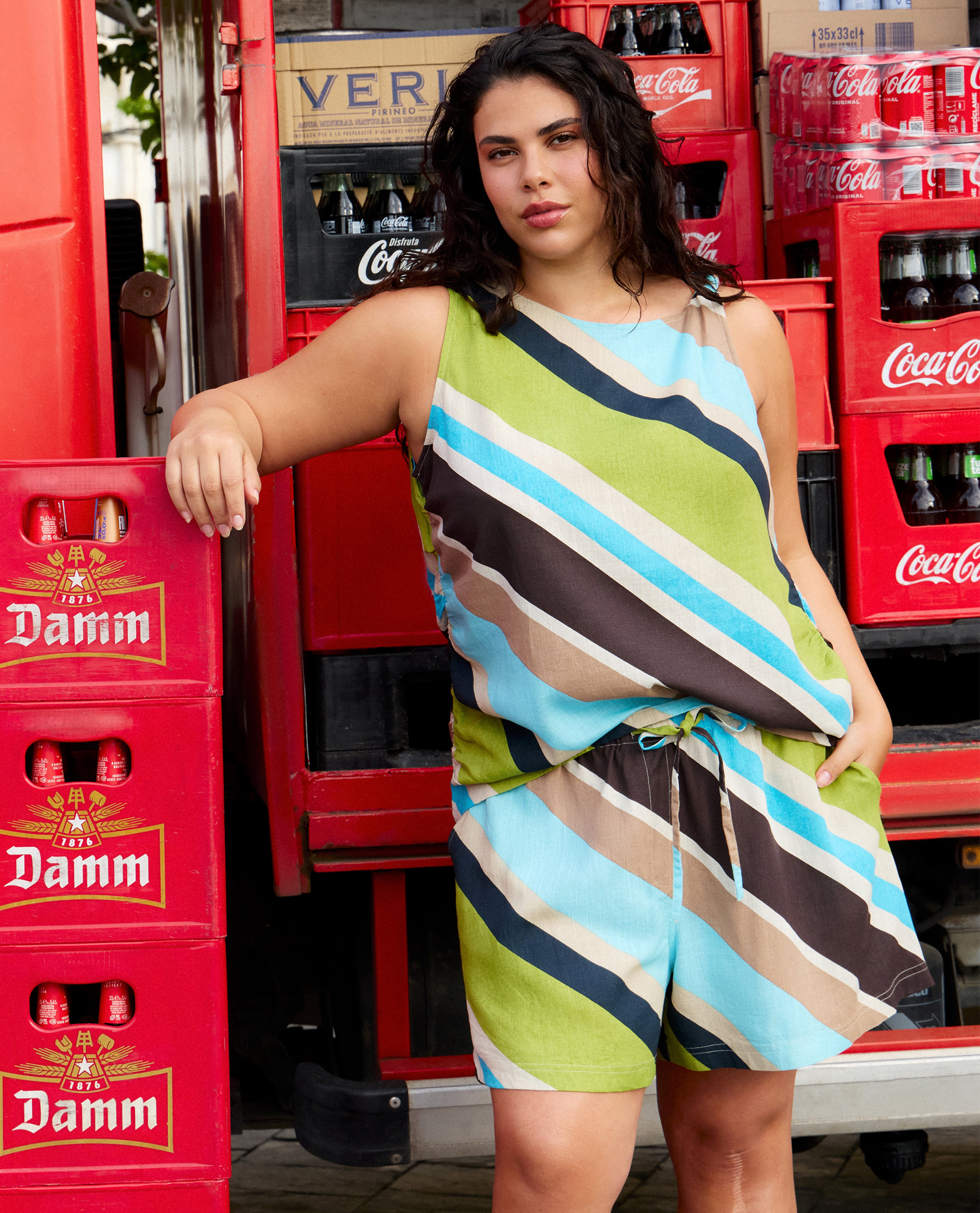 Model wears multi-coloured stripe co-ords