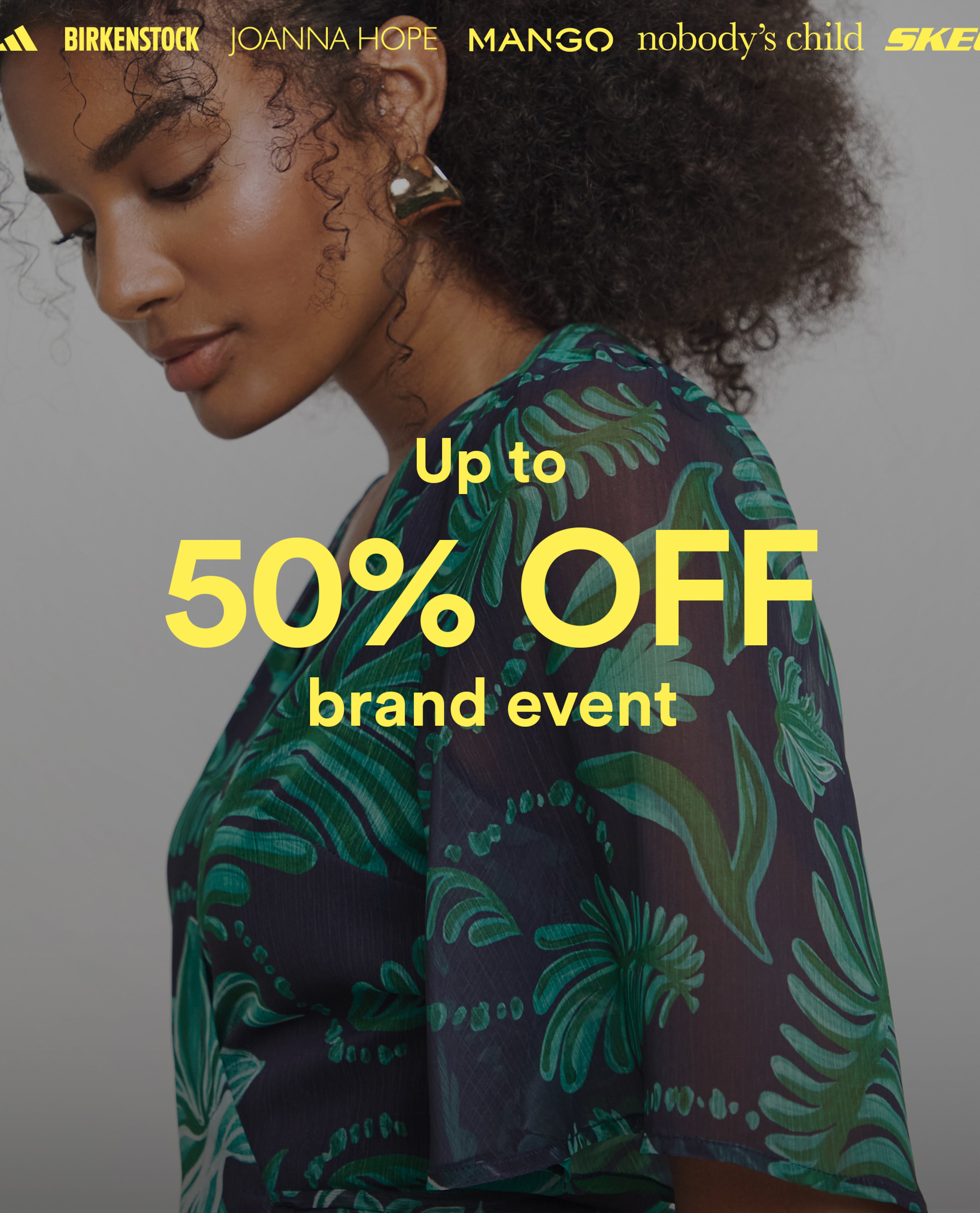 Woman wearing a dark green patterned outfit with text promoting up to 50percent off a brand event.
