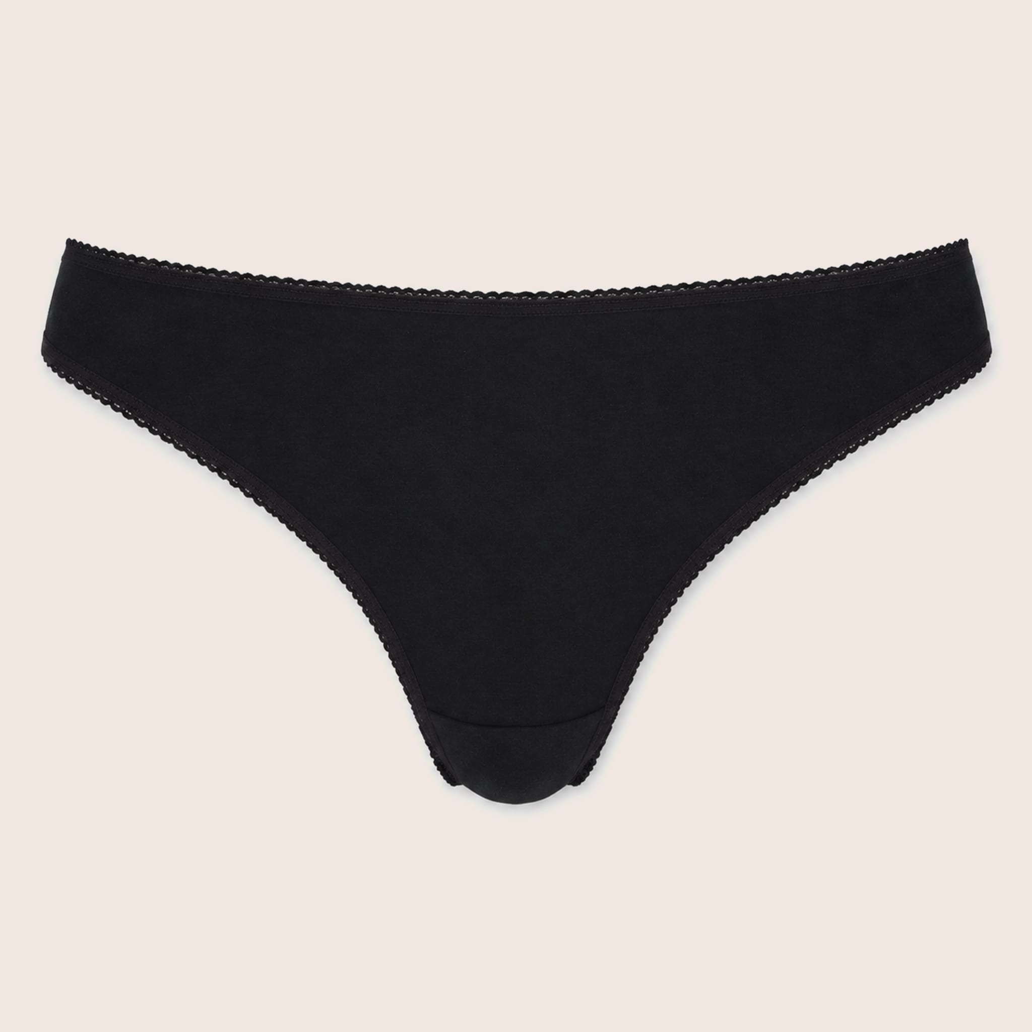 black knickers on peach background thongs