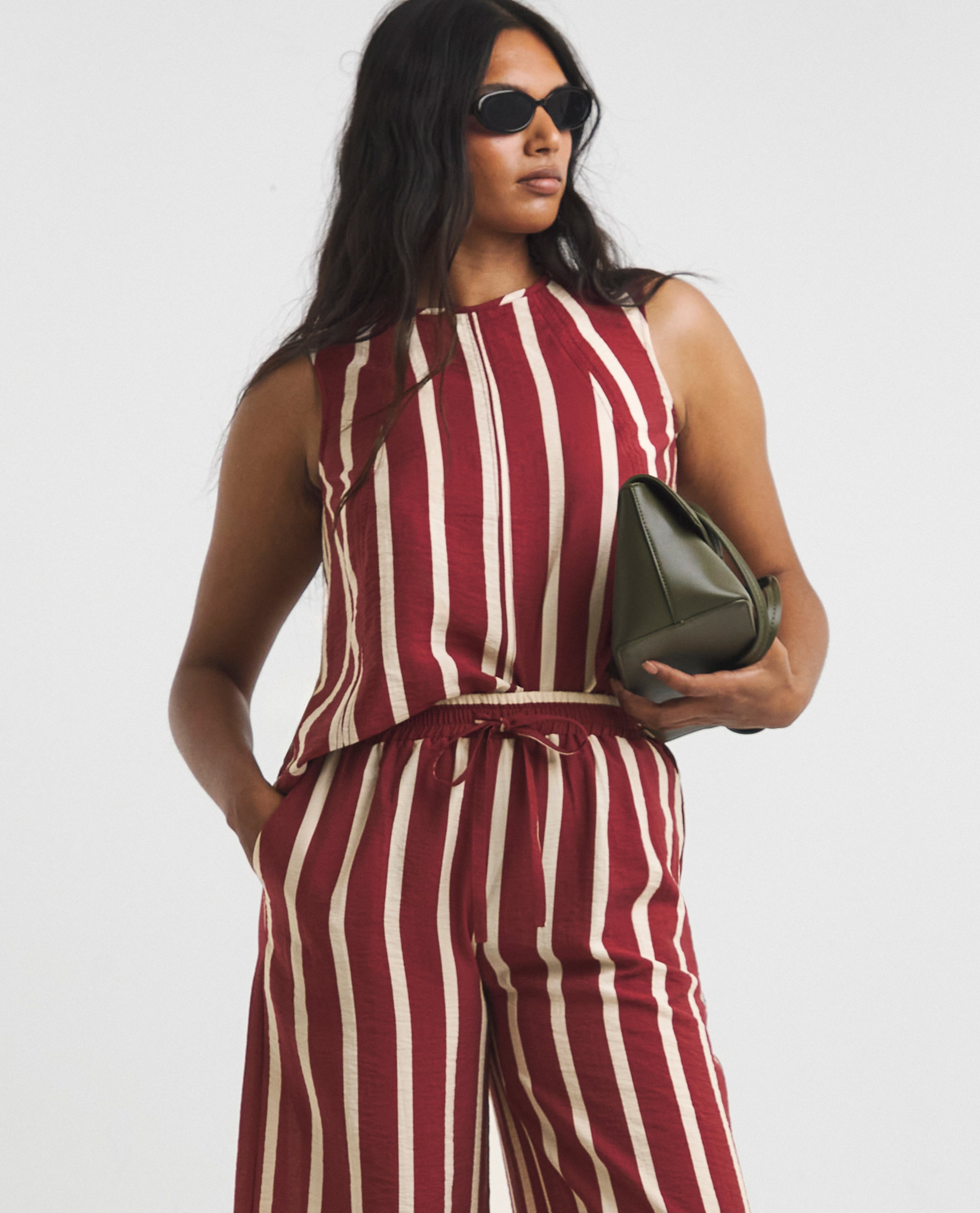 Model wears red and white striped co-ords