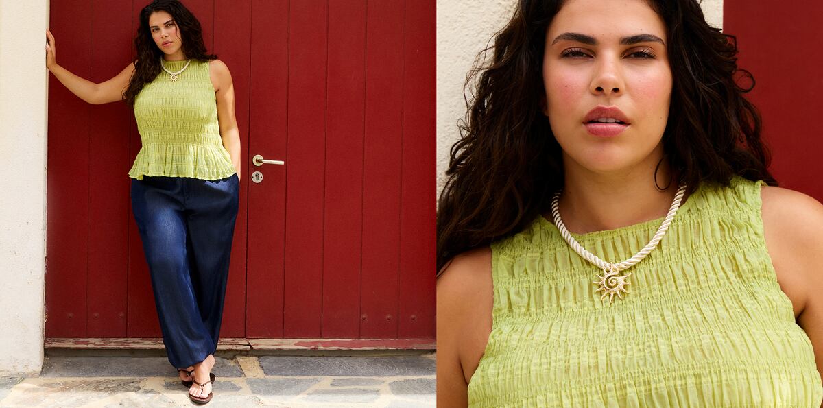 Woman wearing a lime green textured sleeveless top and navy trousers, with a close-up showing a sun pendant necklace.