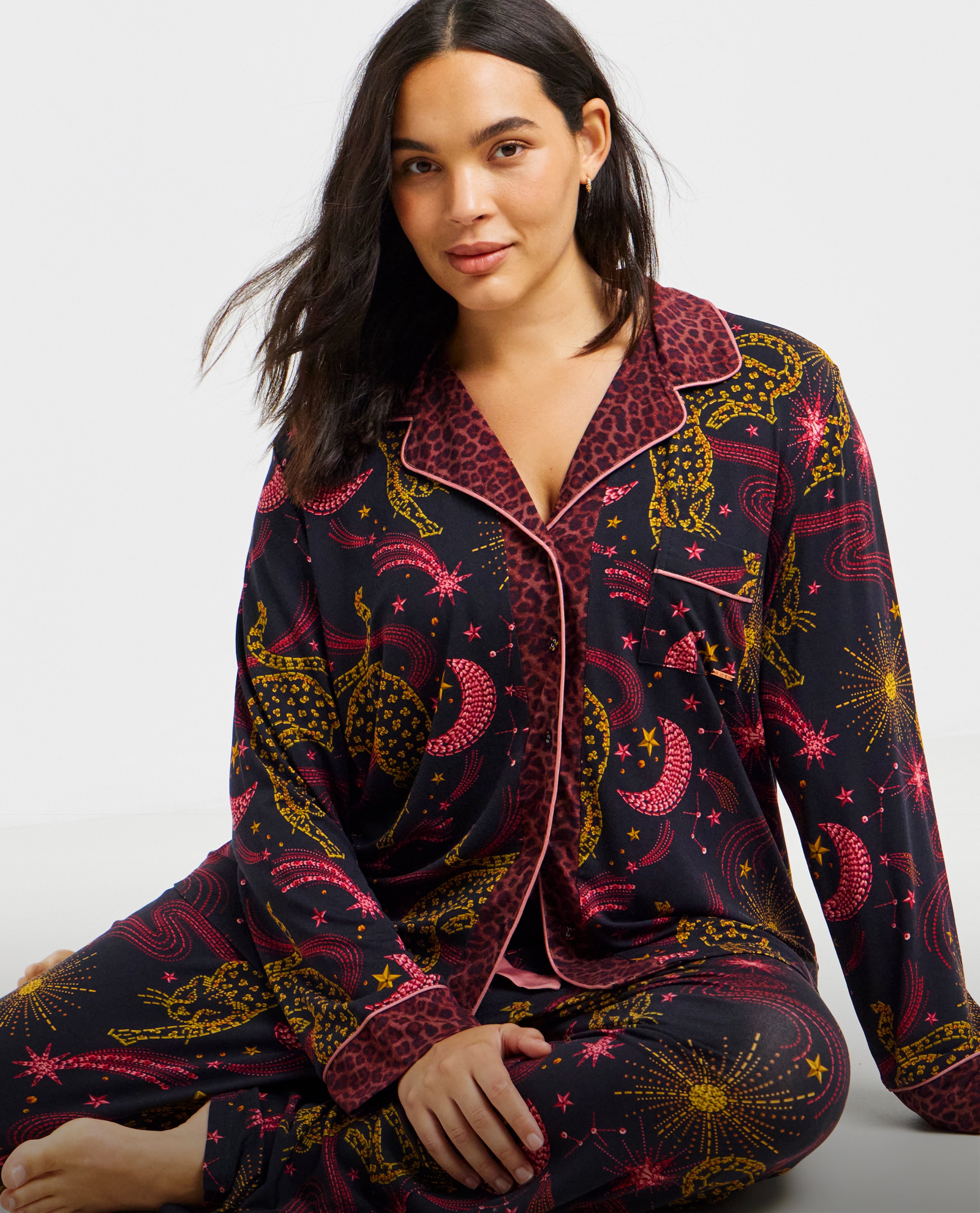Model sat down wearing nightwear