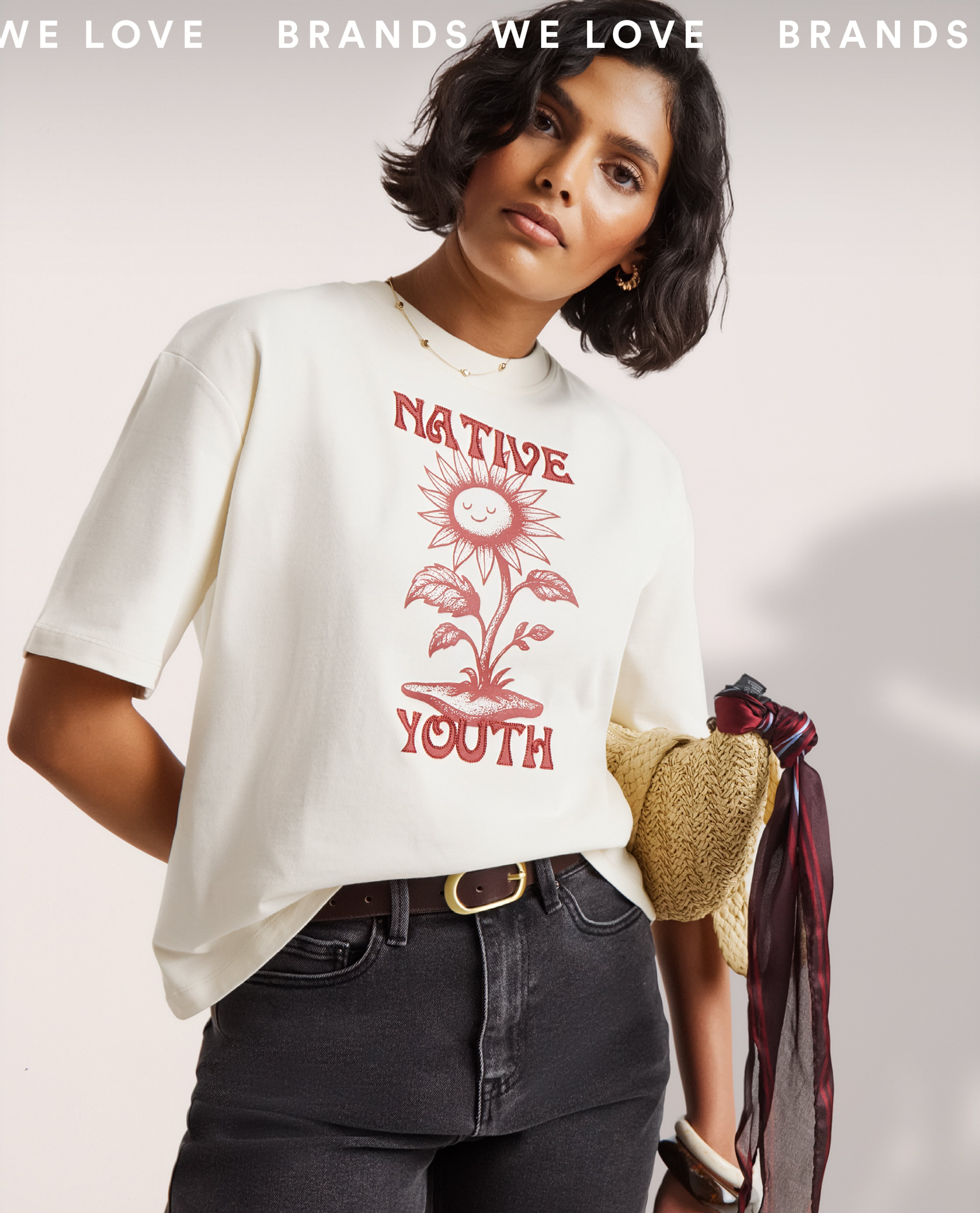 Model wears graphic tee from Native Youth