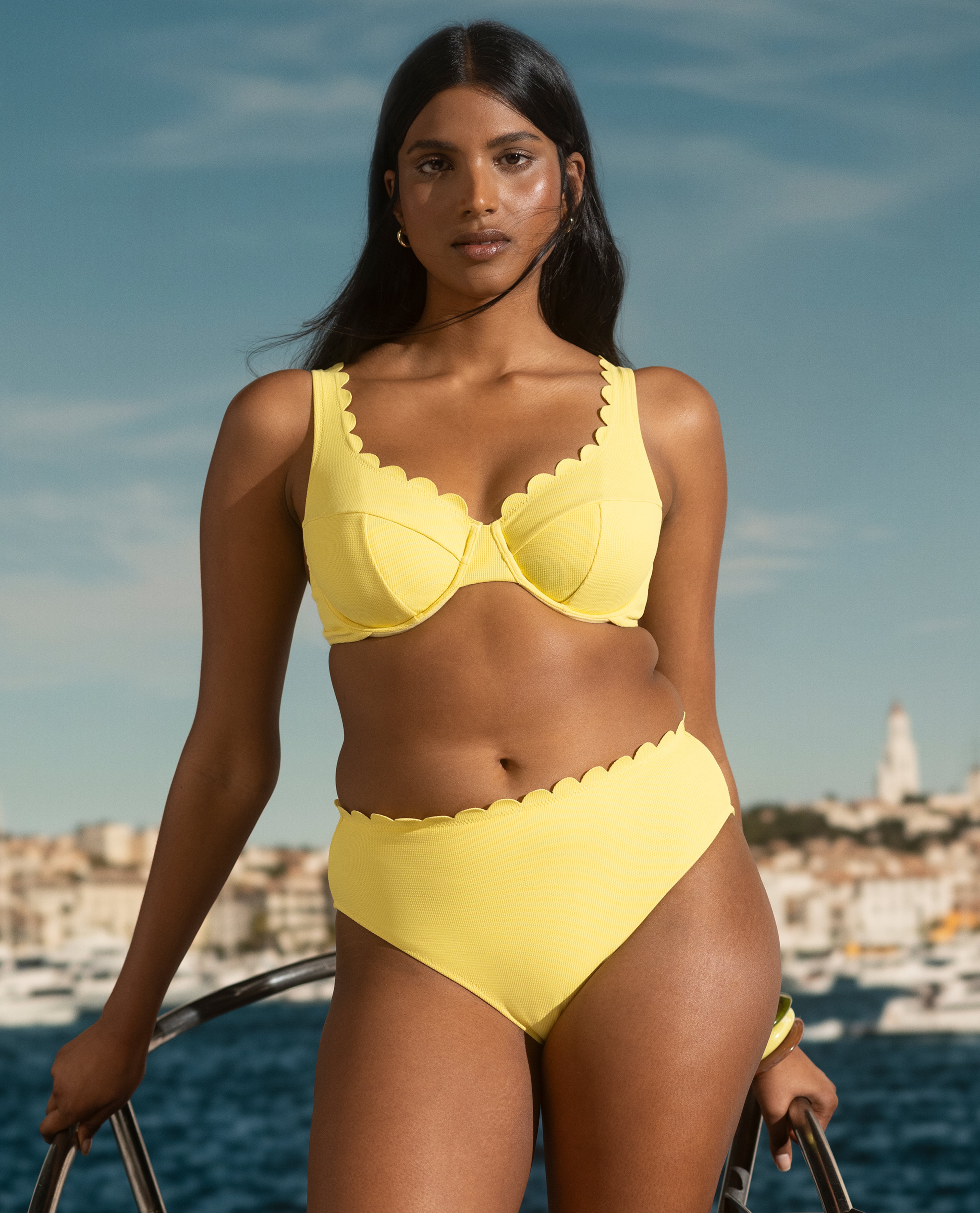 Model wears swimwear set in yellow