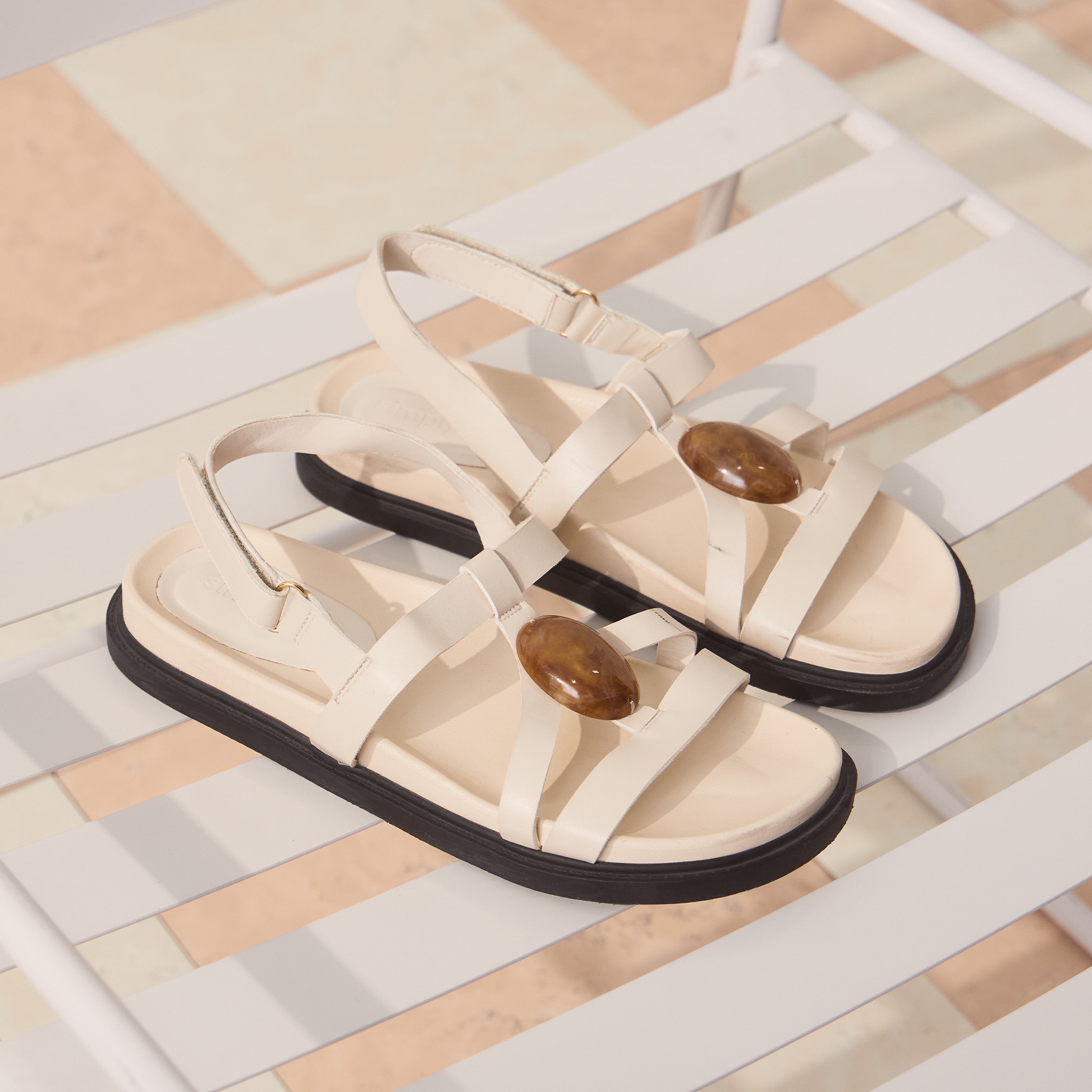 white sandals on table