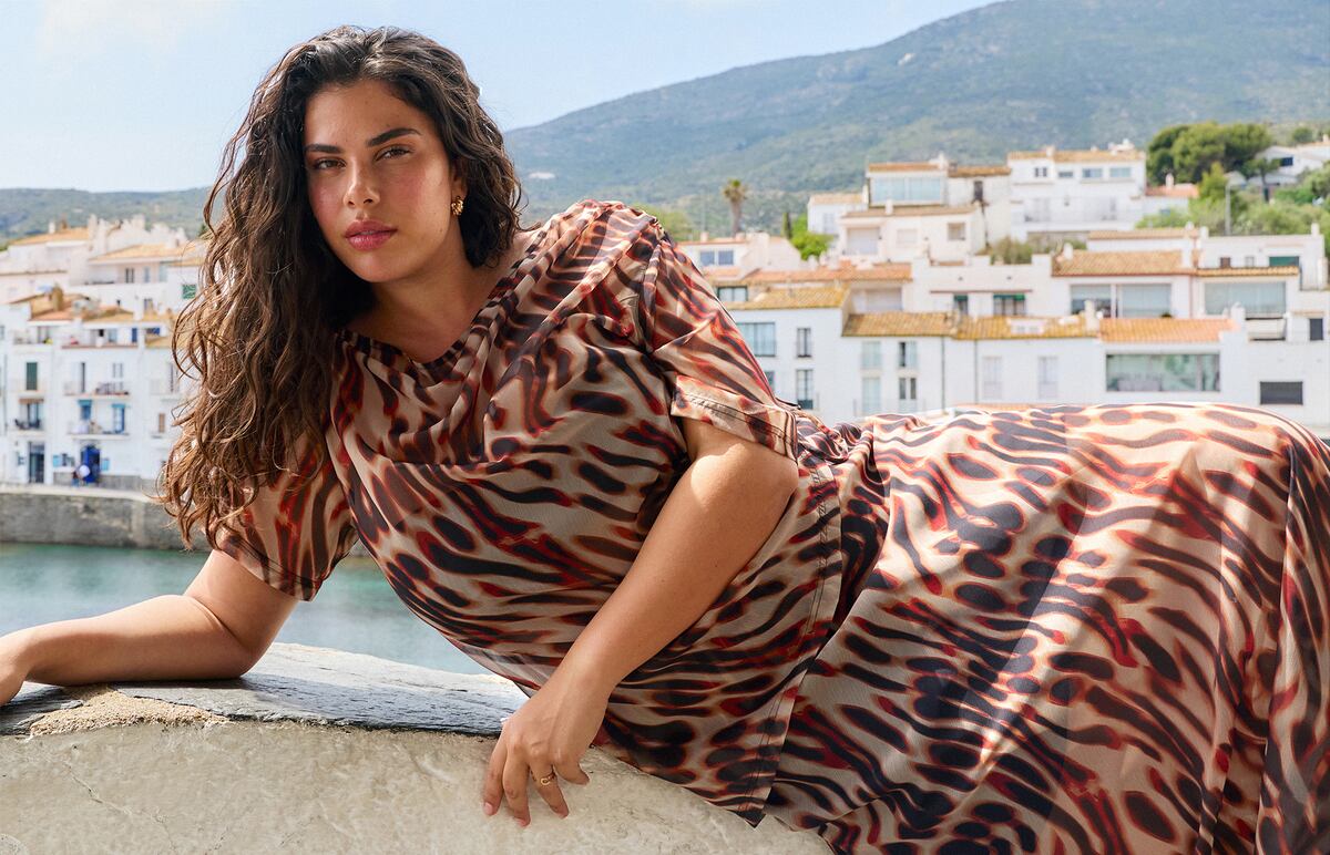 Model wears leopard print dress