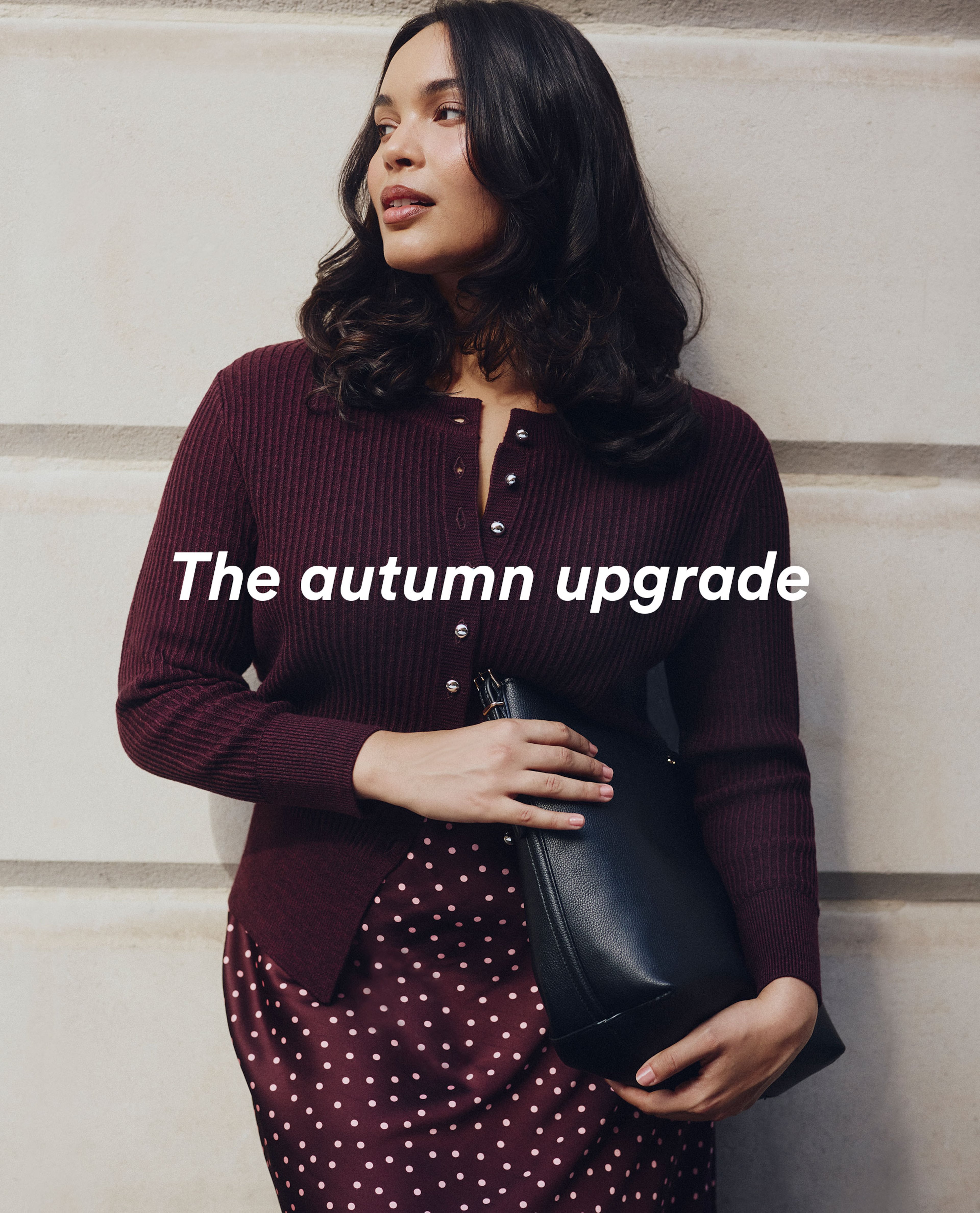The autumn update - model wears dark berry cardigan