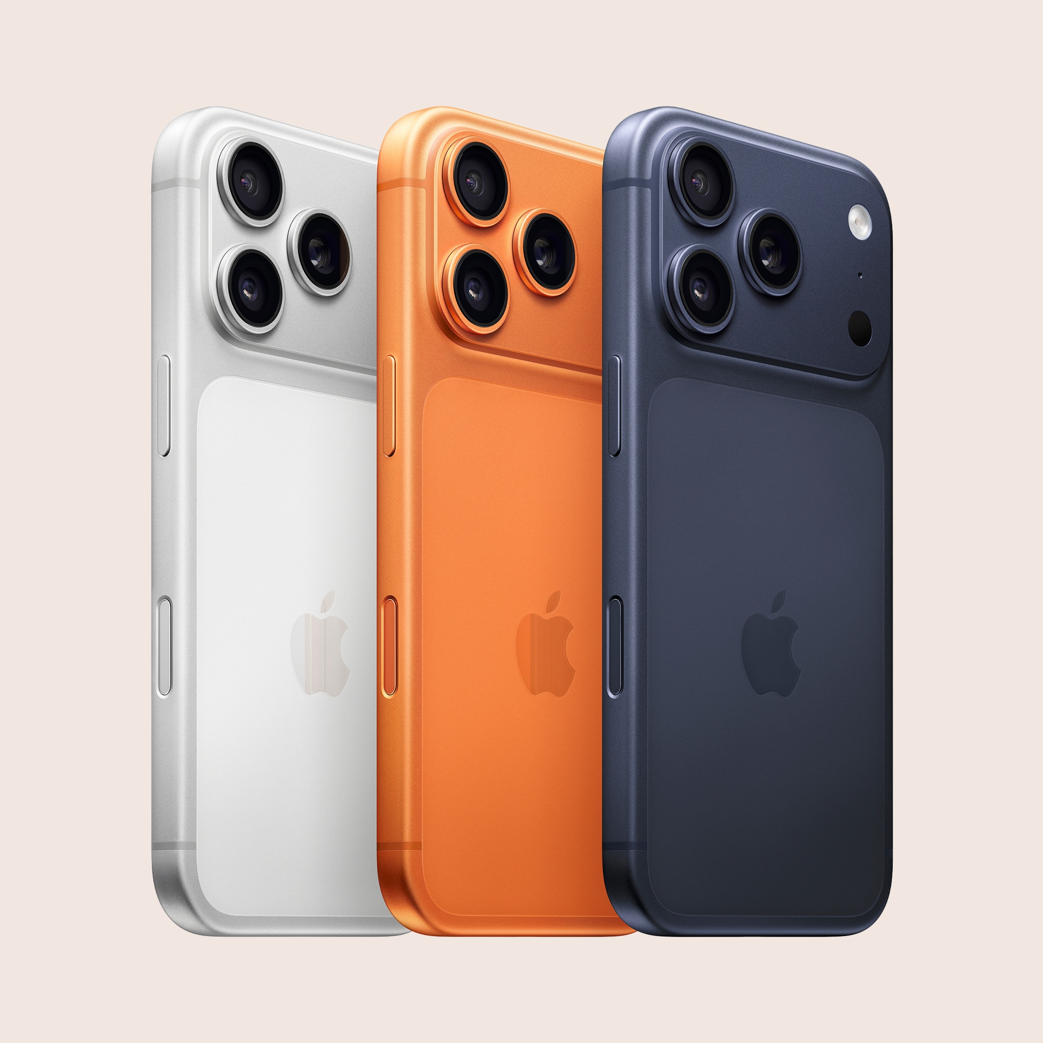 3 iphones apple on peach background