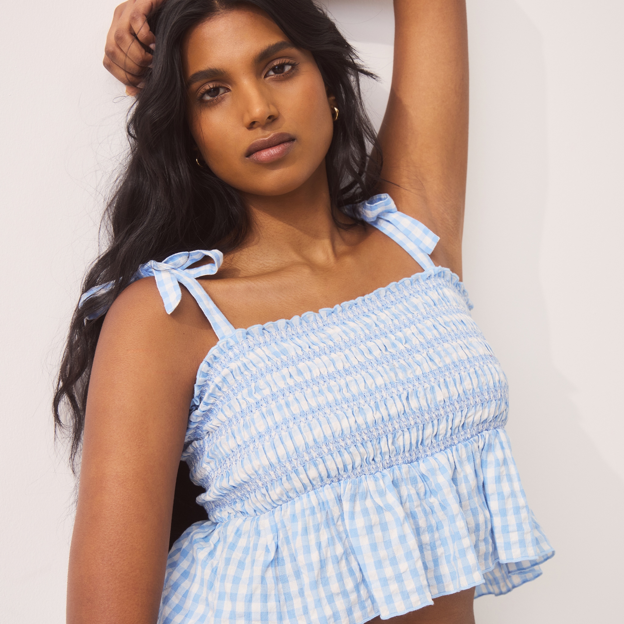 model wearing blue and white top