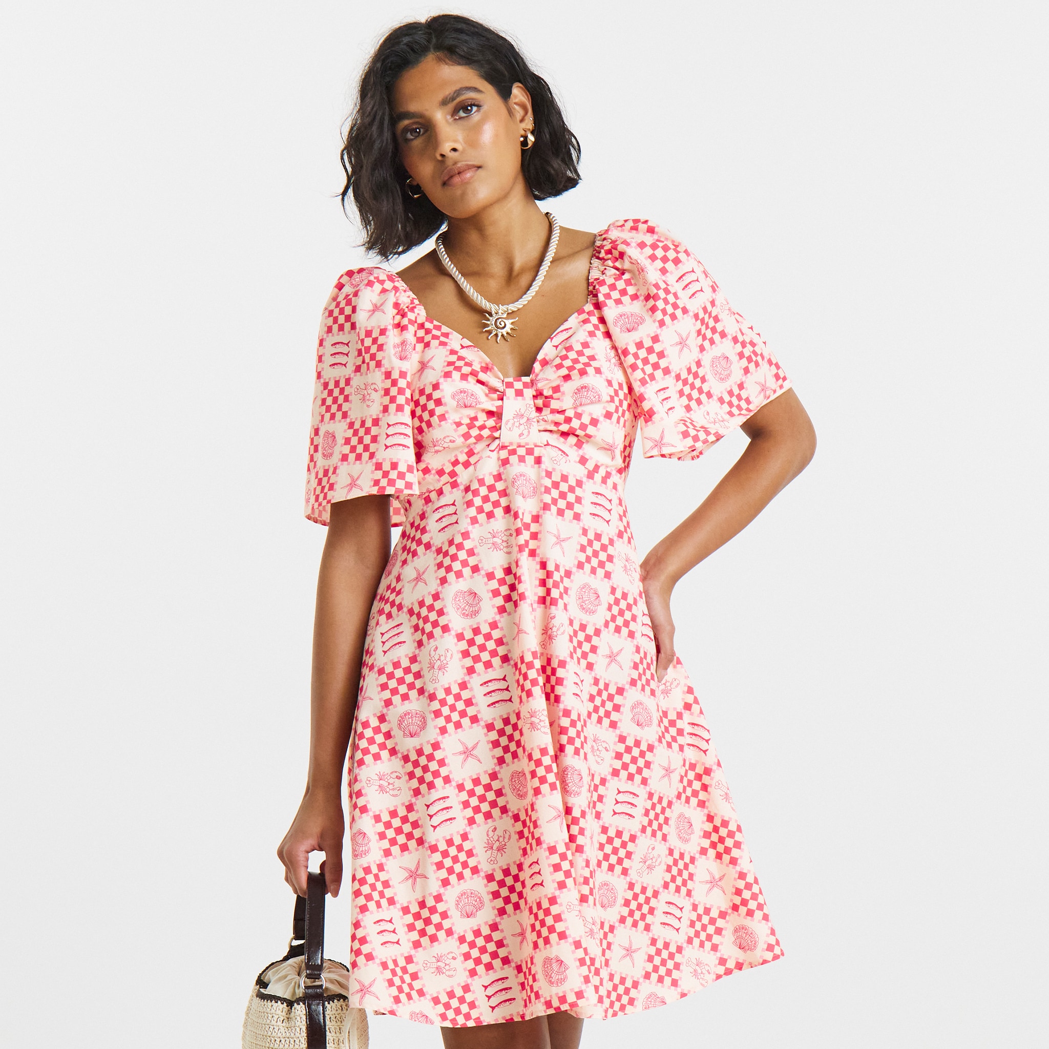 model wearing dress pink and white