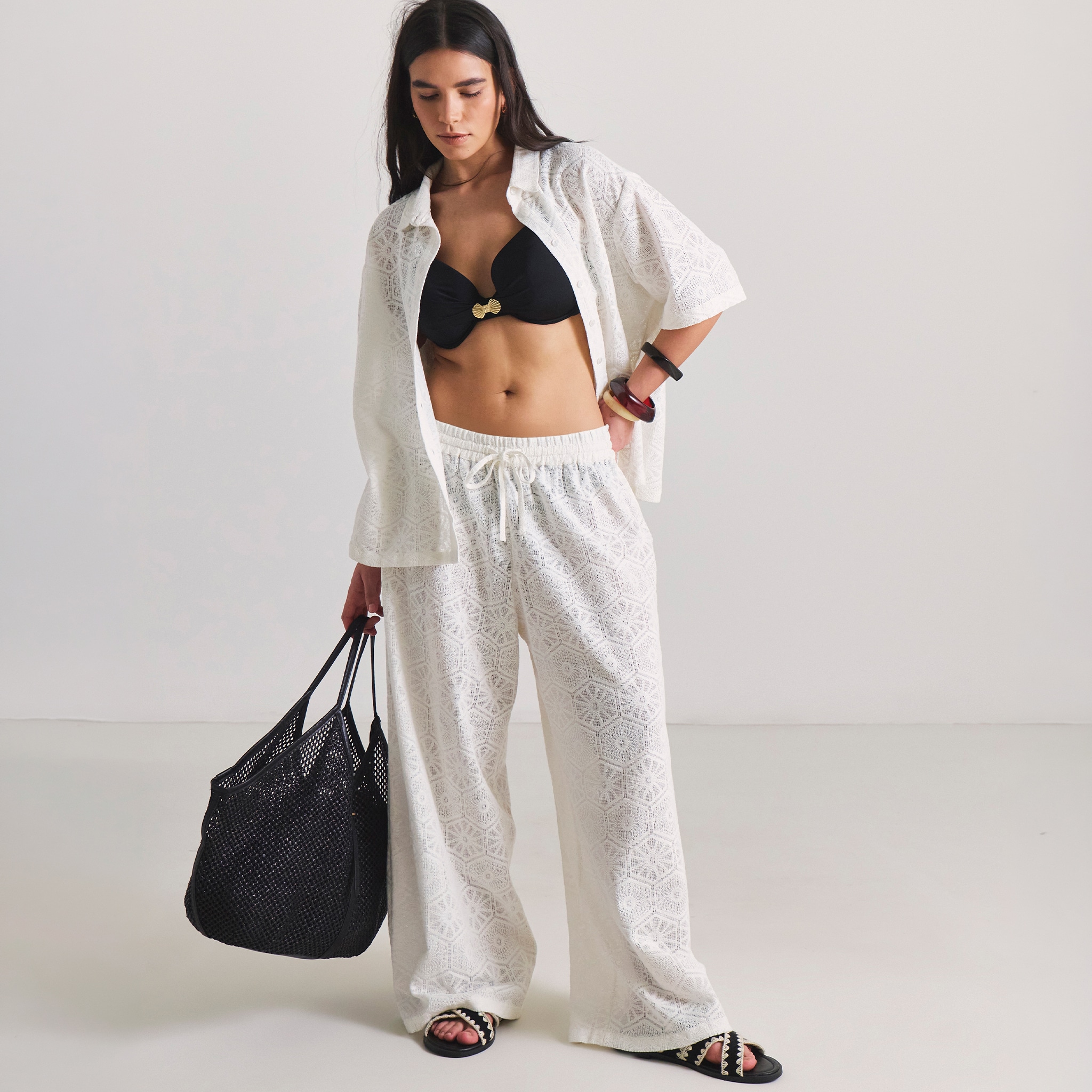 model weraing white beachwear