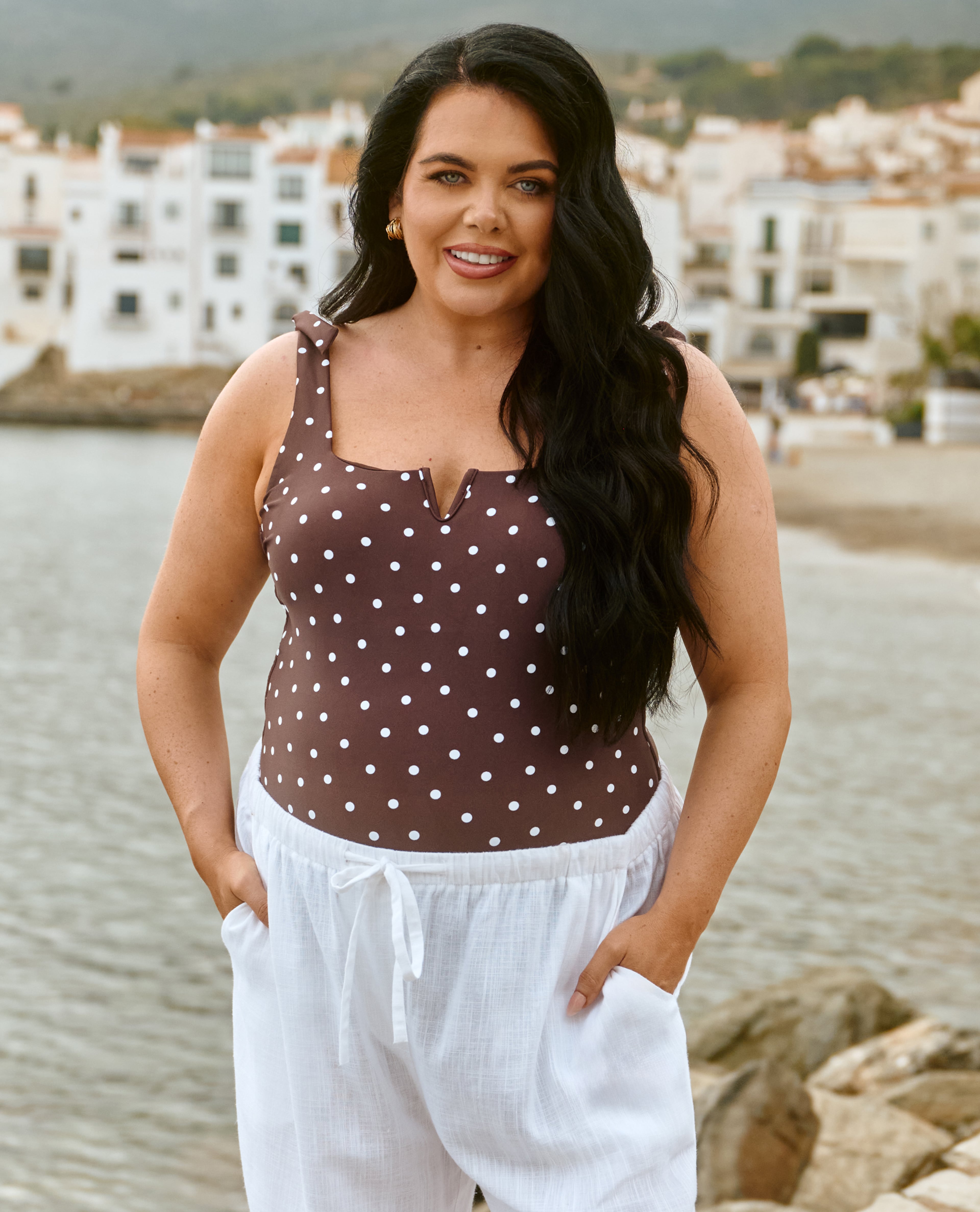Scarlett Moffatt wears spot swimwear and white trousers