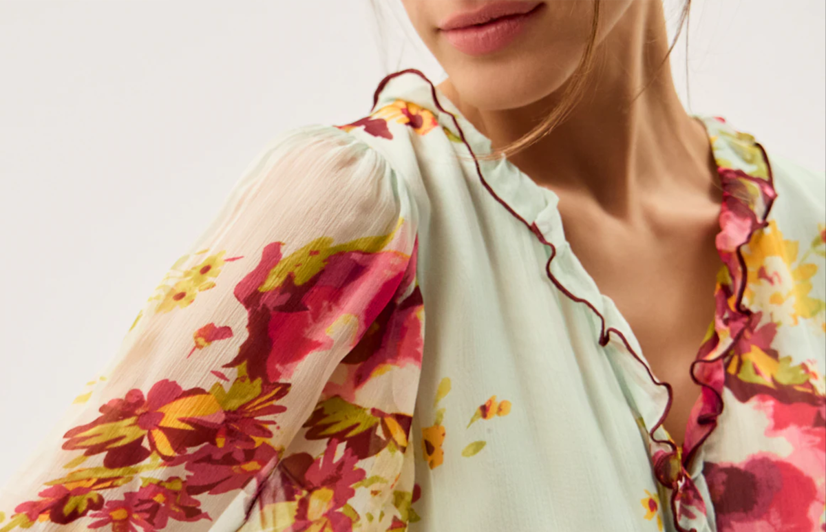 Model wearing multi colured dress monsoon