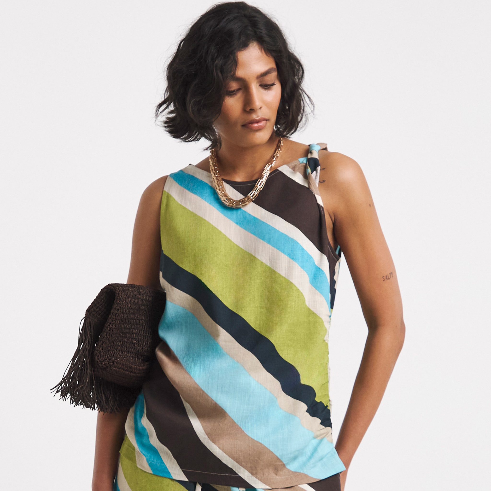 Model wearing multi colour top