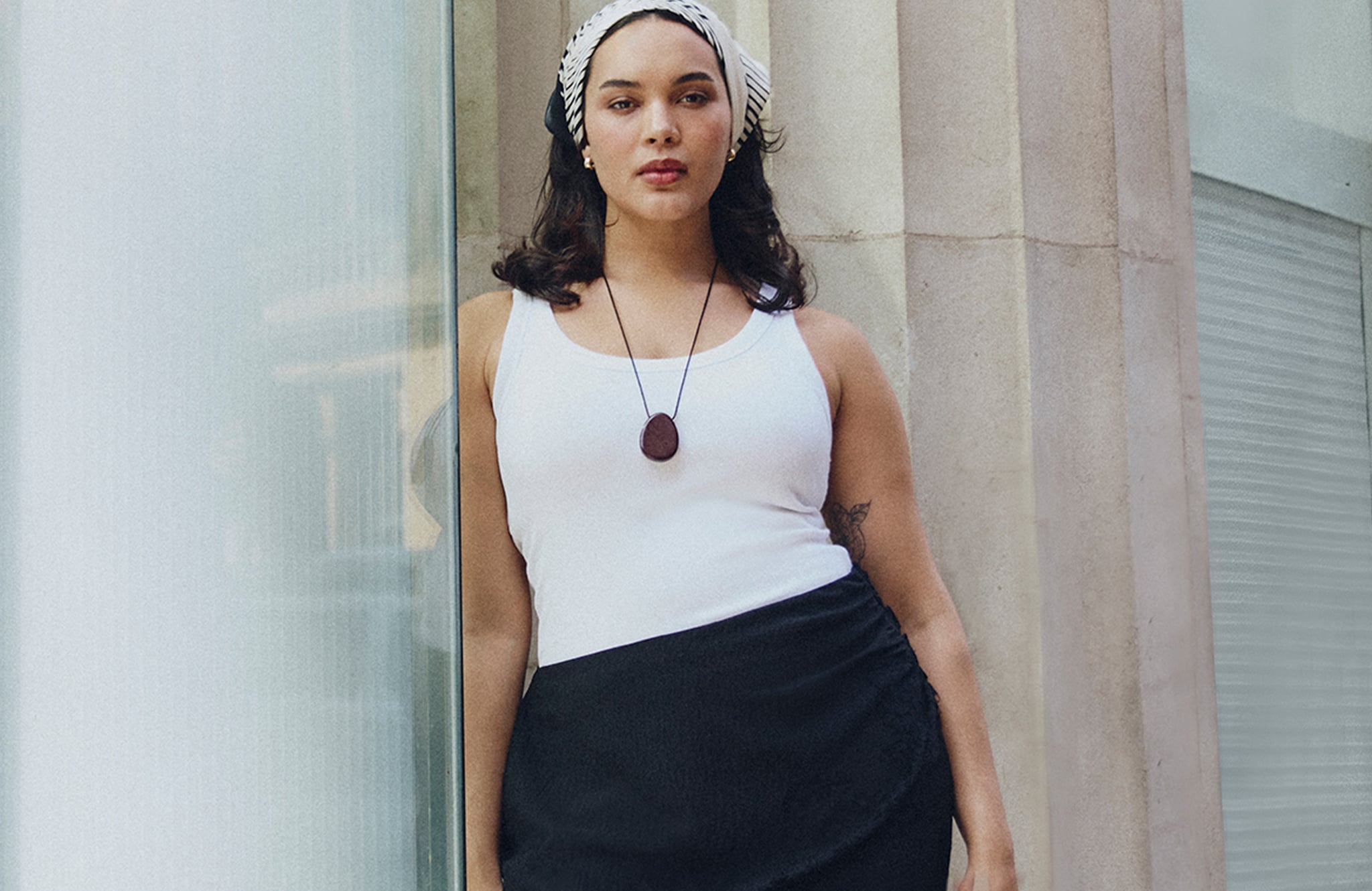 Model wears white vest