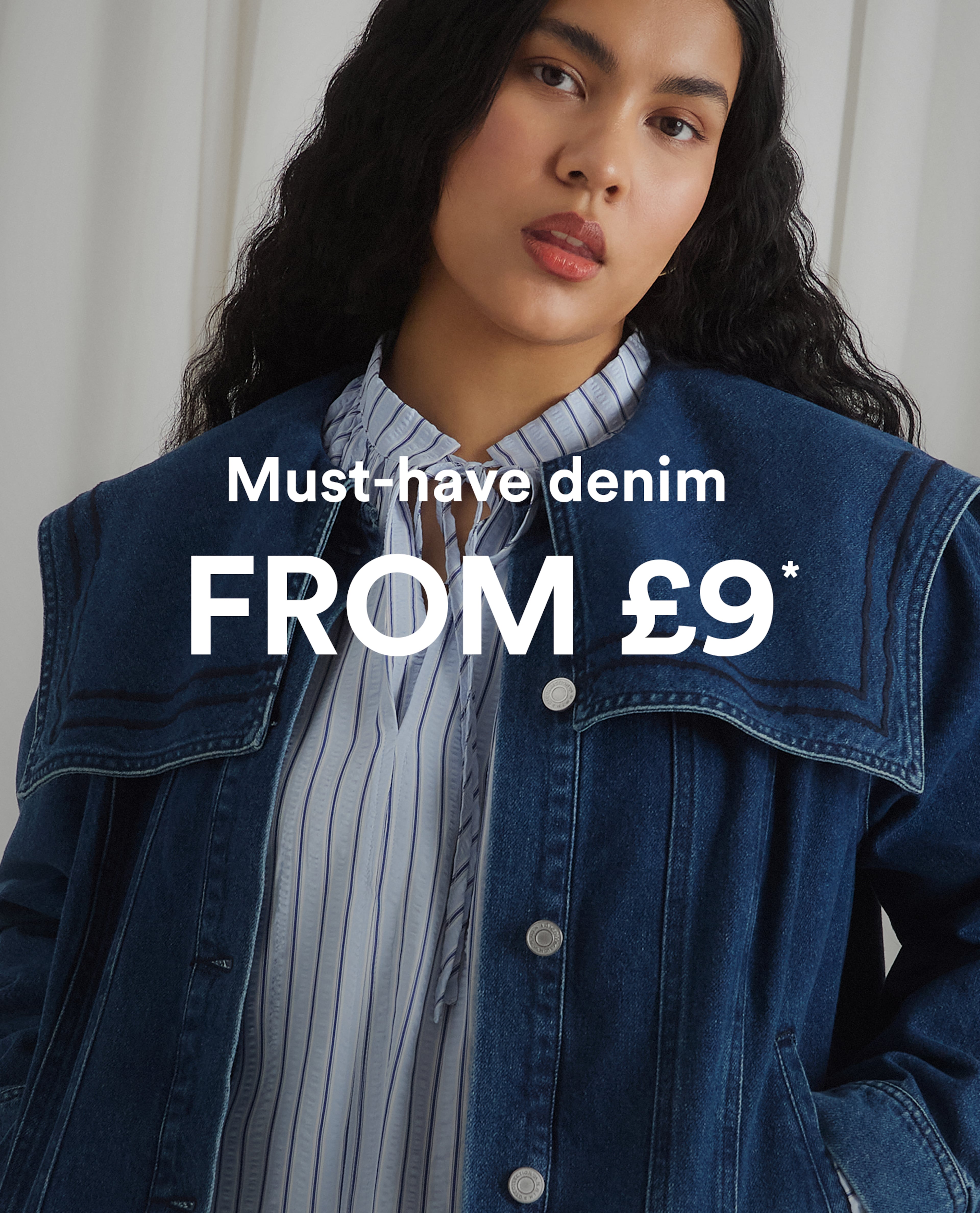 Model wearing a blue denim jacket over a striped blouse; 