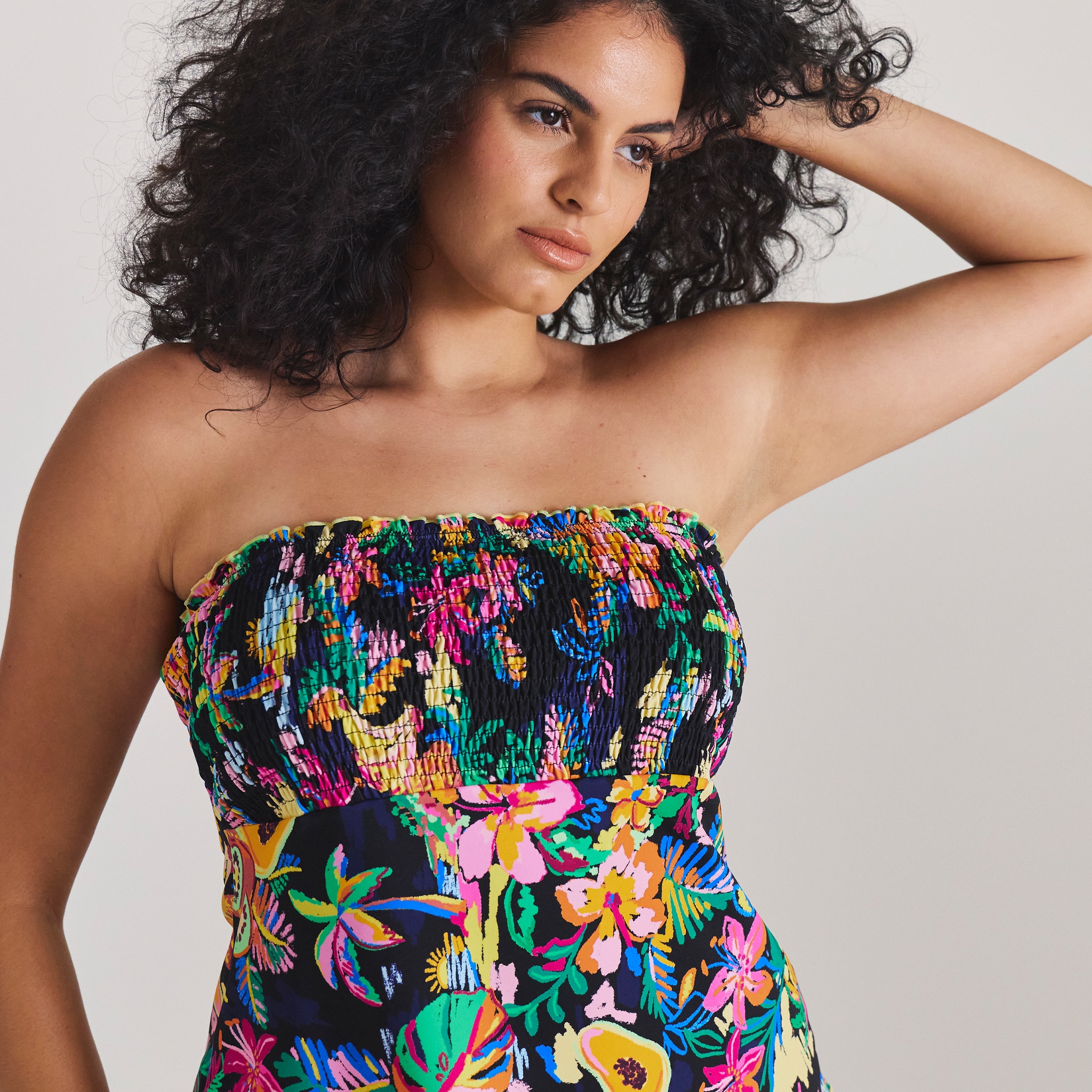 Model wearing multi coloured Tankini top