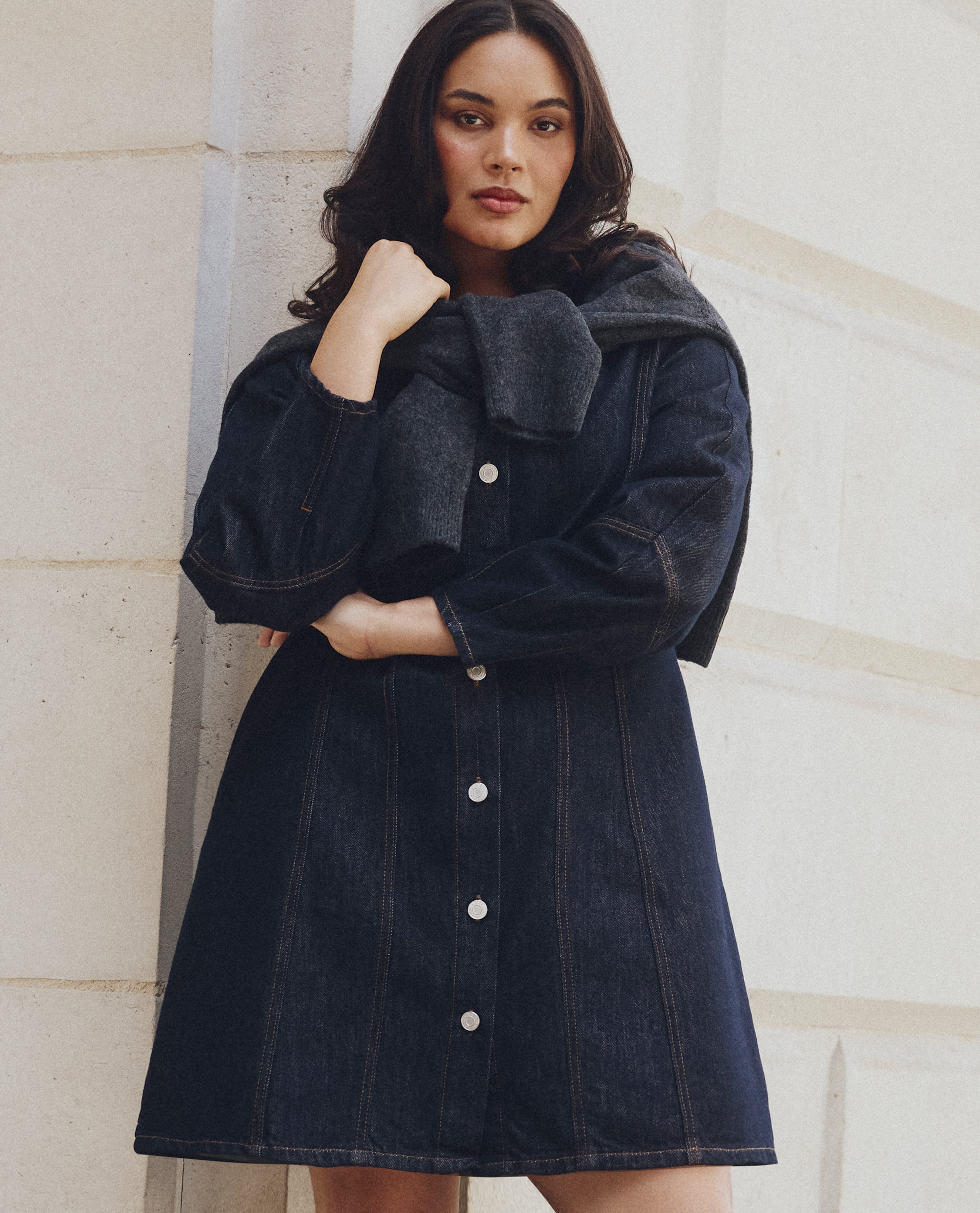 Model wears new season denim dress