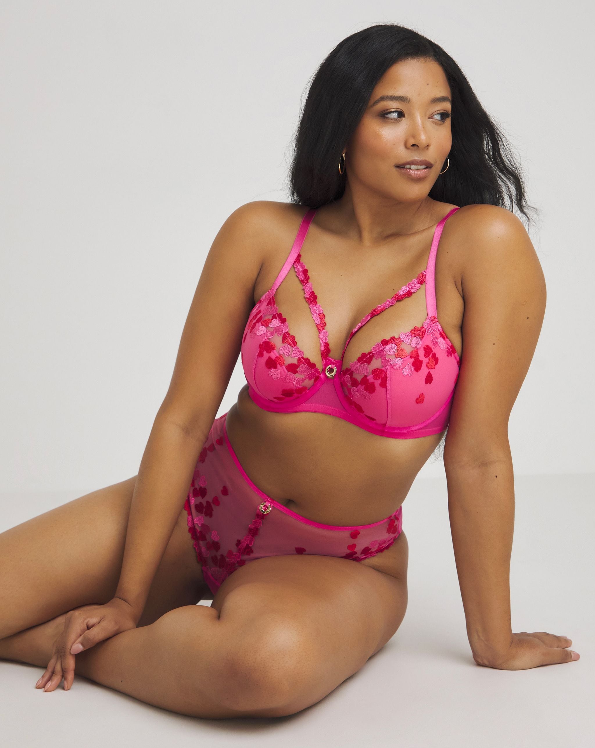 Model wearing a pink bra and knickers