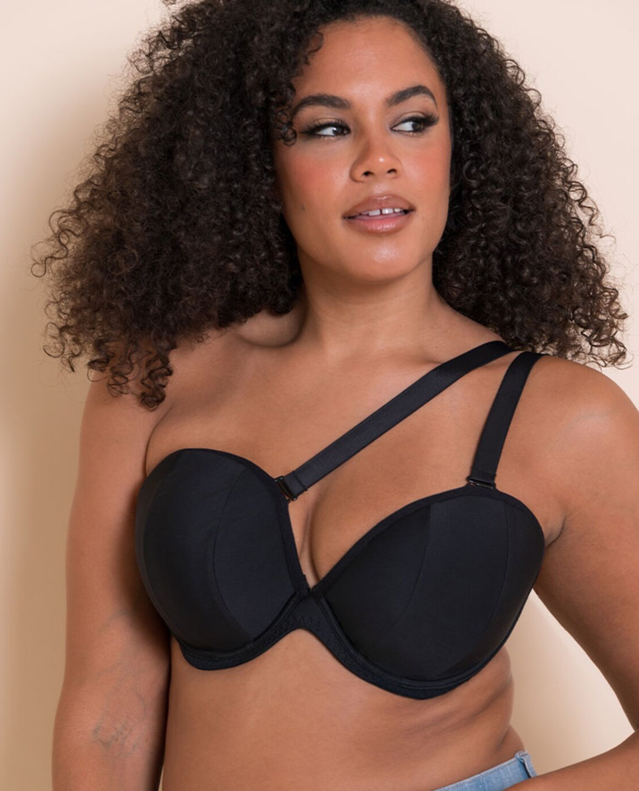 Model is wearing a Curvy Kate Superhero multiway padded plunge wired bra in black