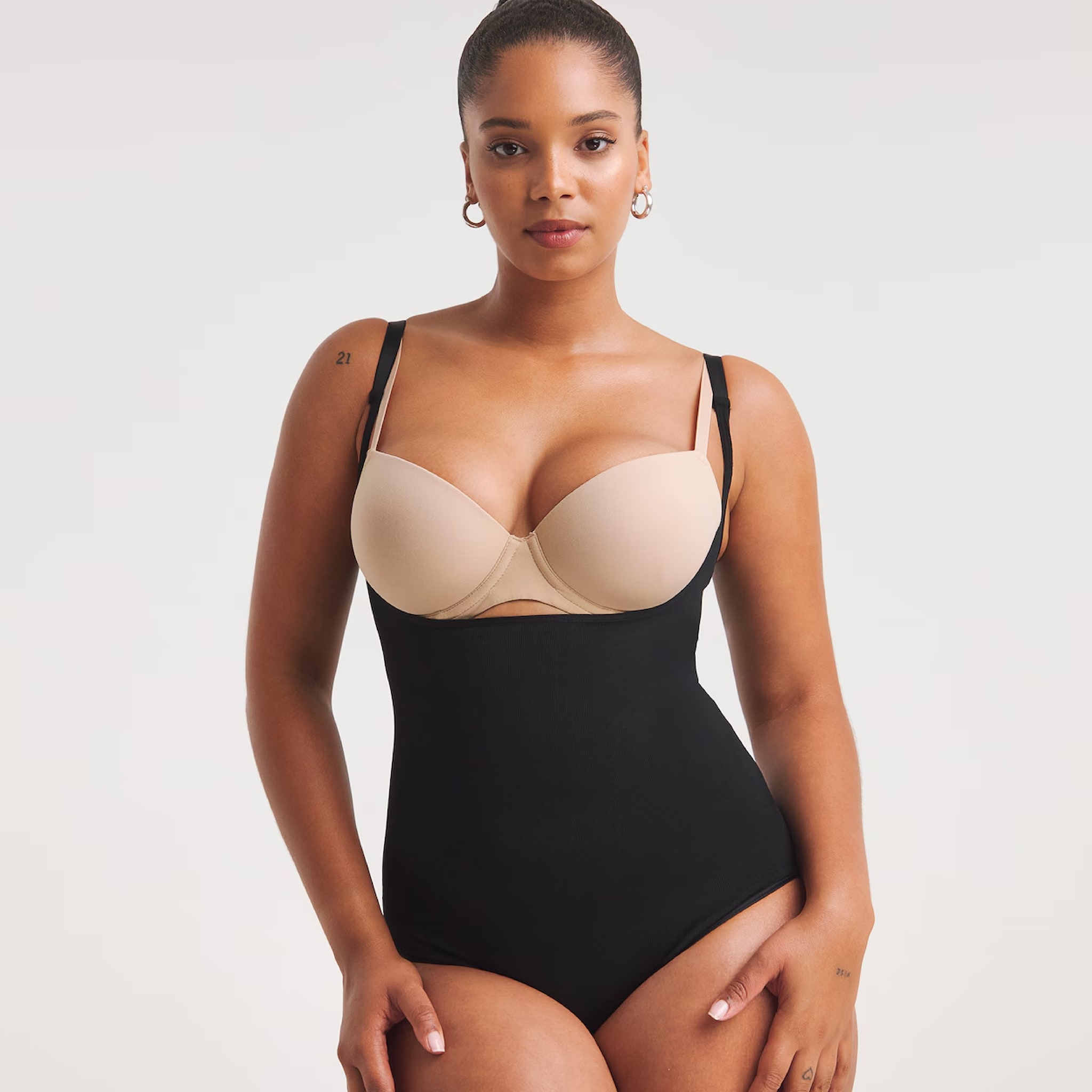 A model wearing a 2 tone shape wear slip
