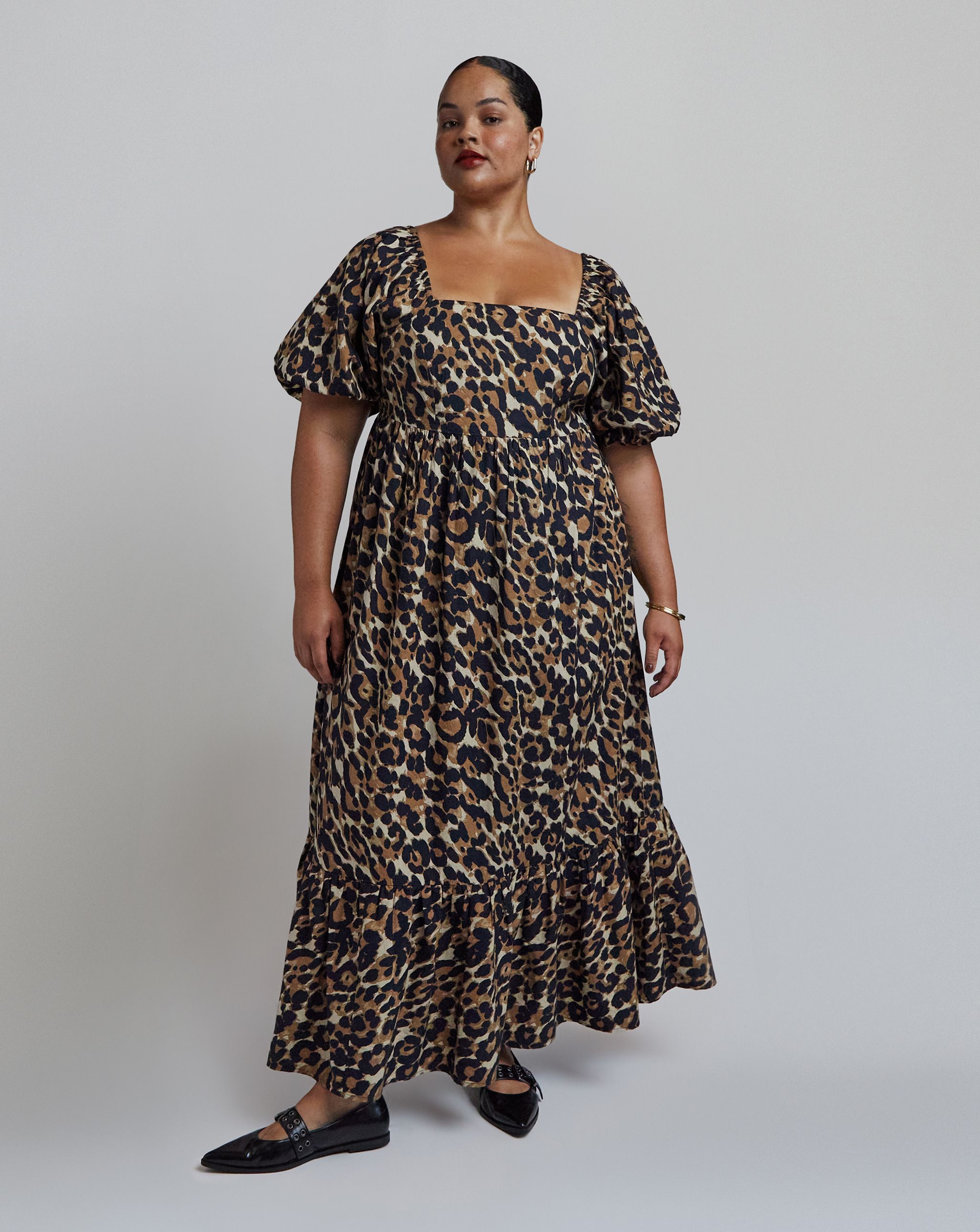 Model wears leopard print dress