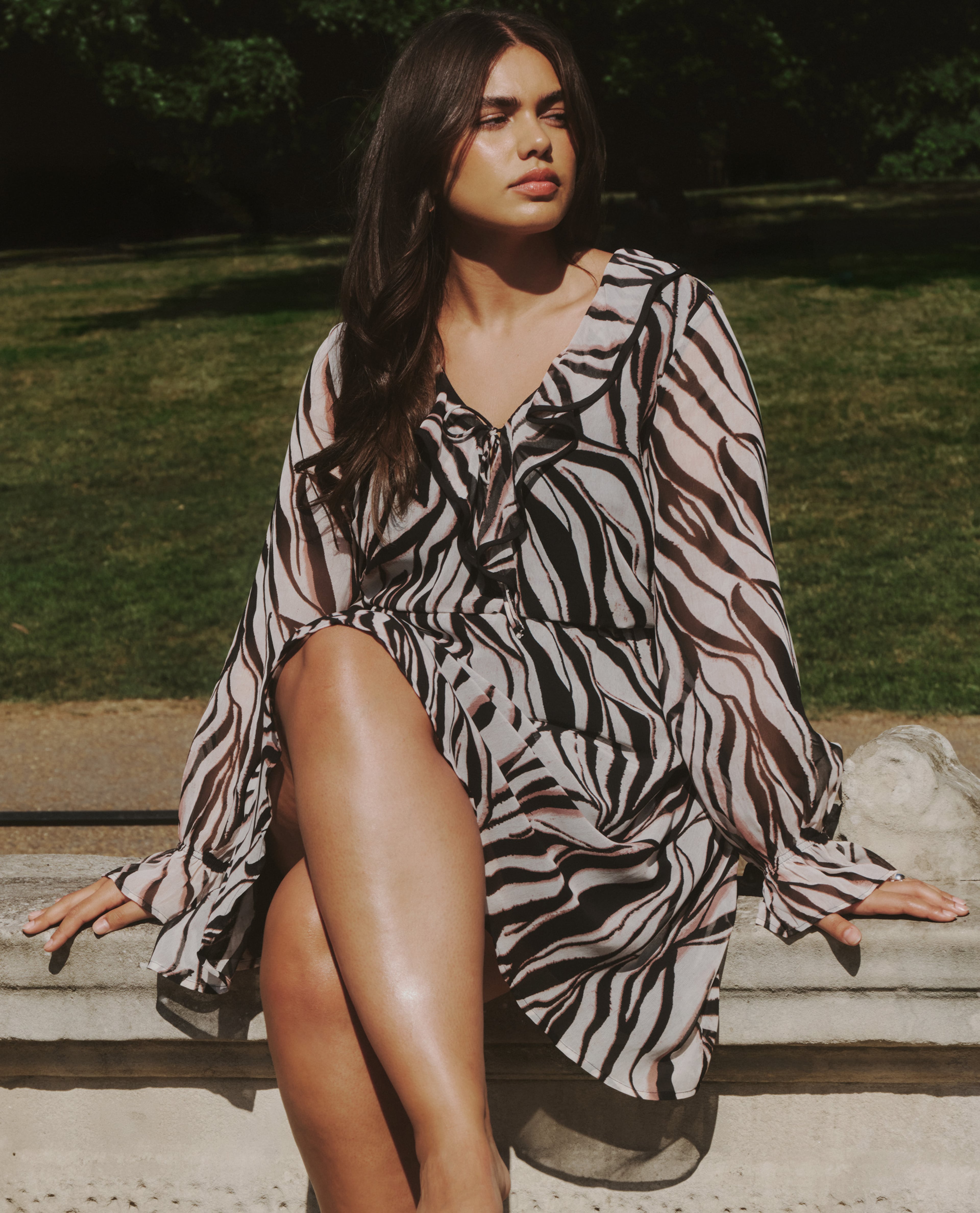 model sat on wall summer stripe dress