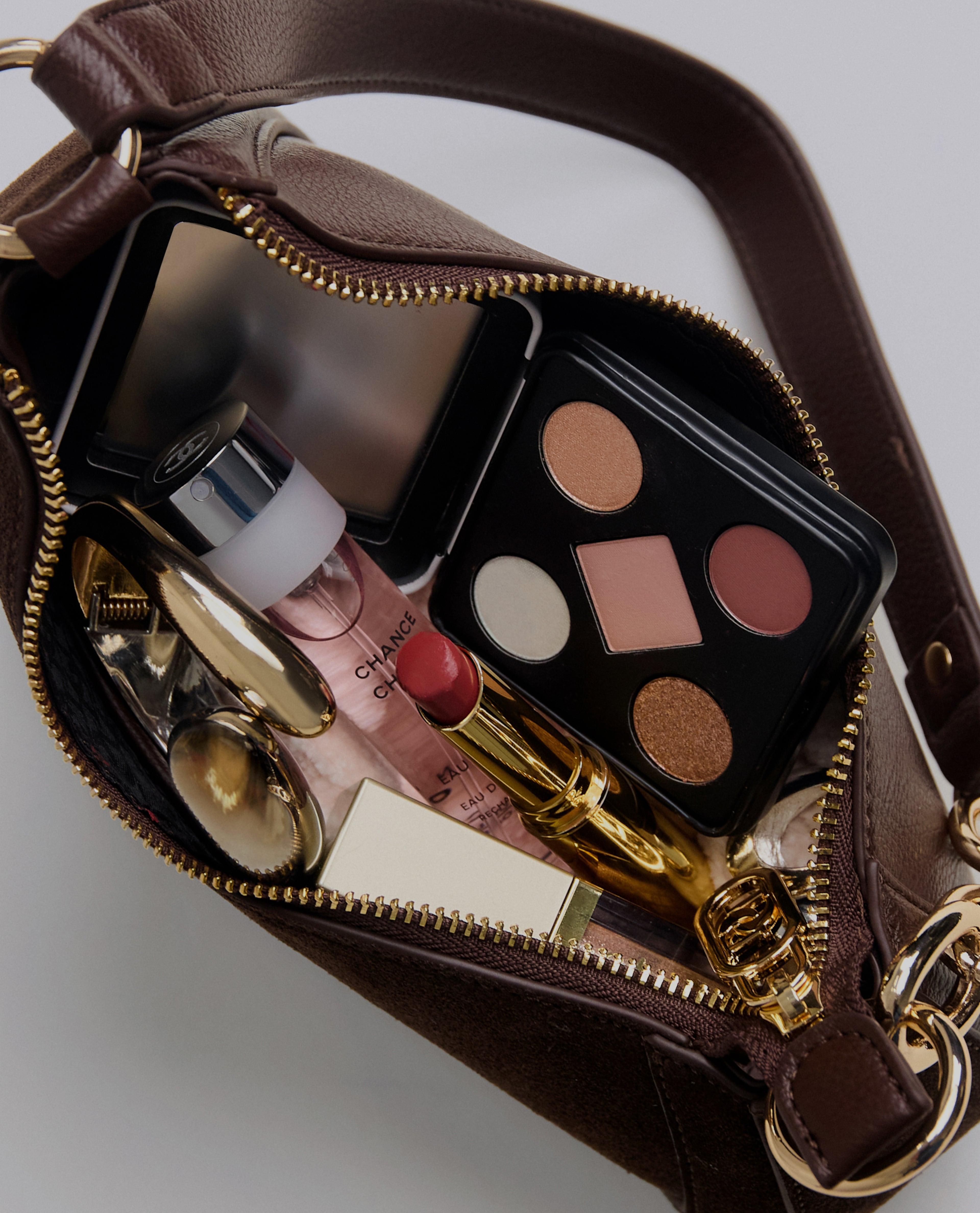 Handbag containing various beauty products