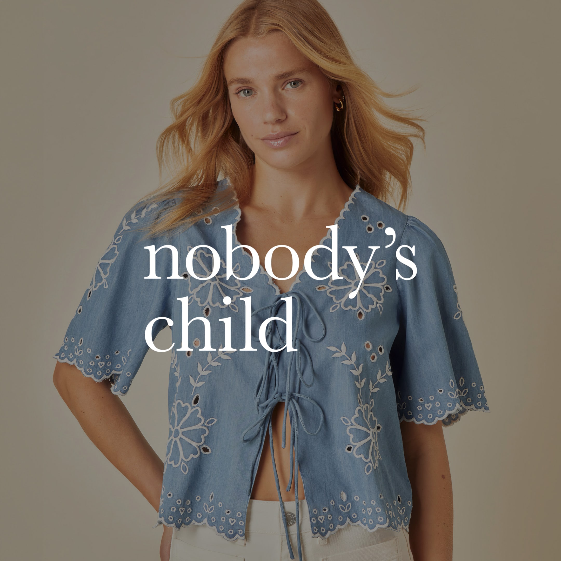 Model wearing Nobody's Child blue top
