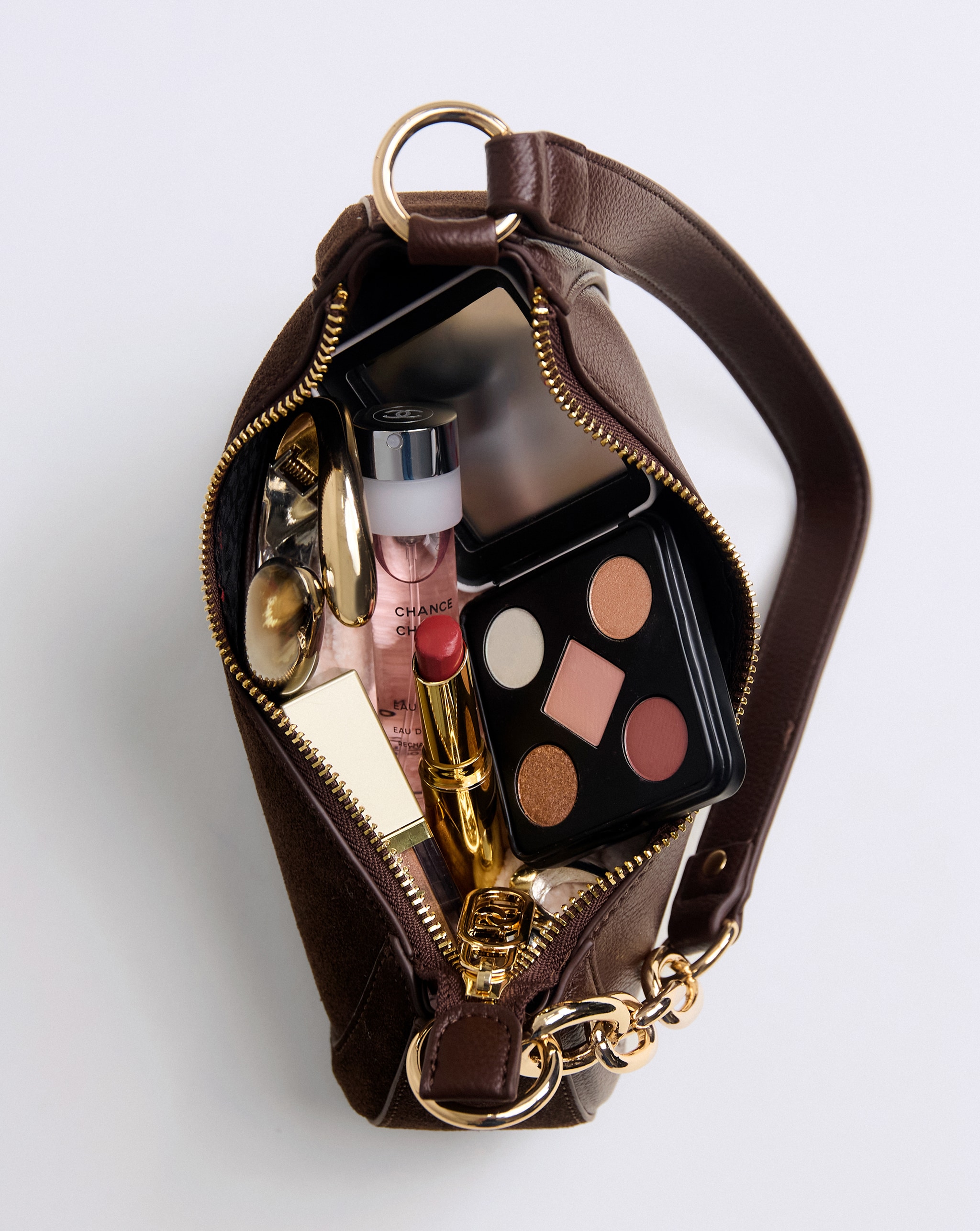 Hand bag containing a range of beauty products