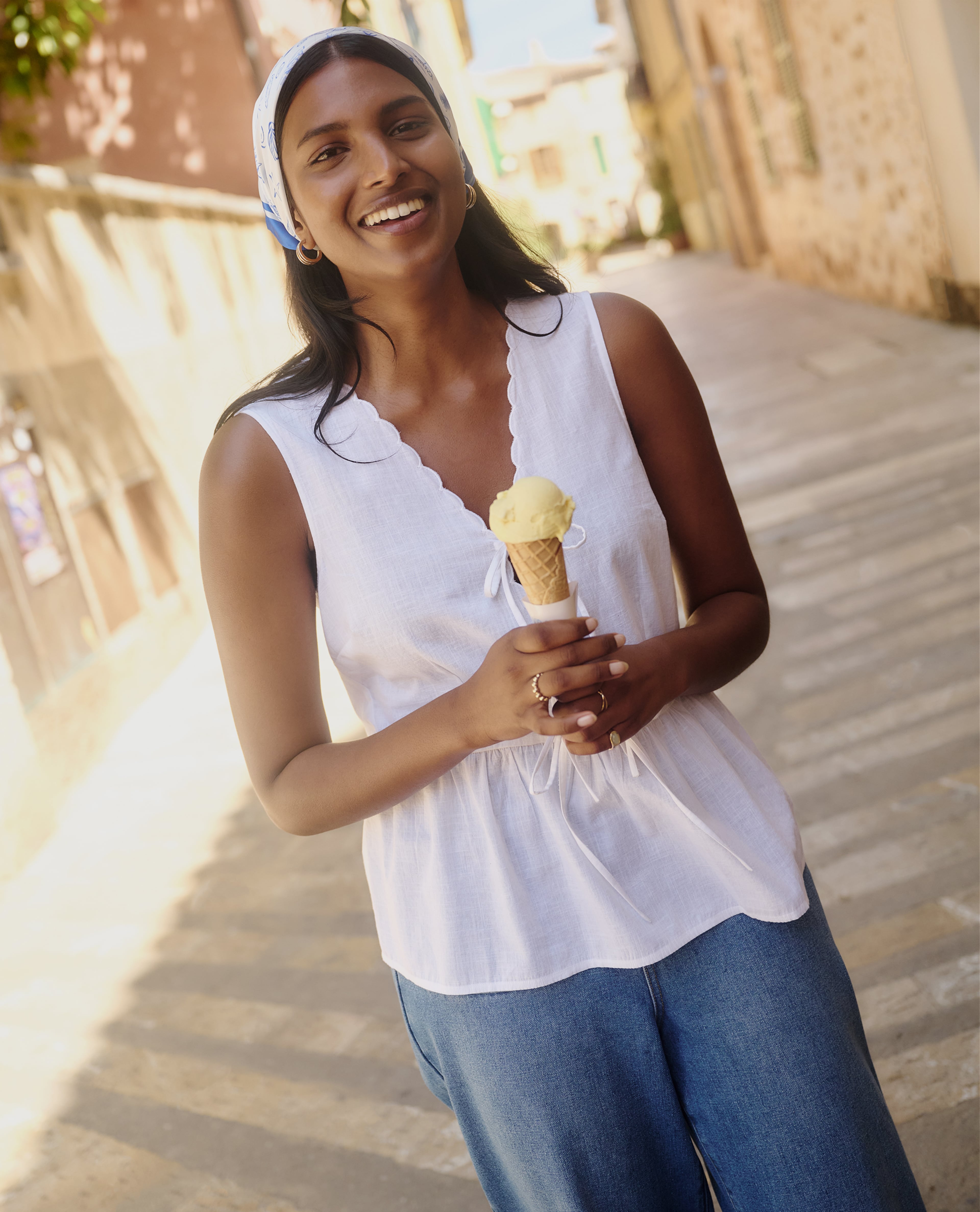 Model wears white summer top