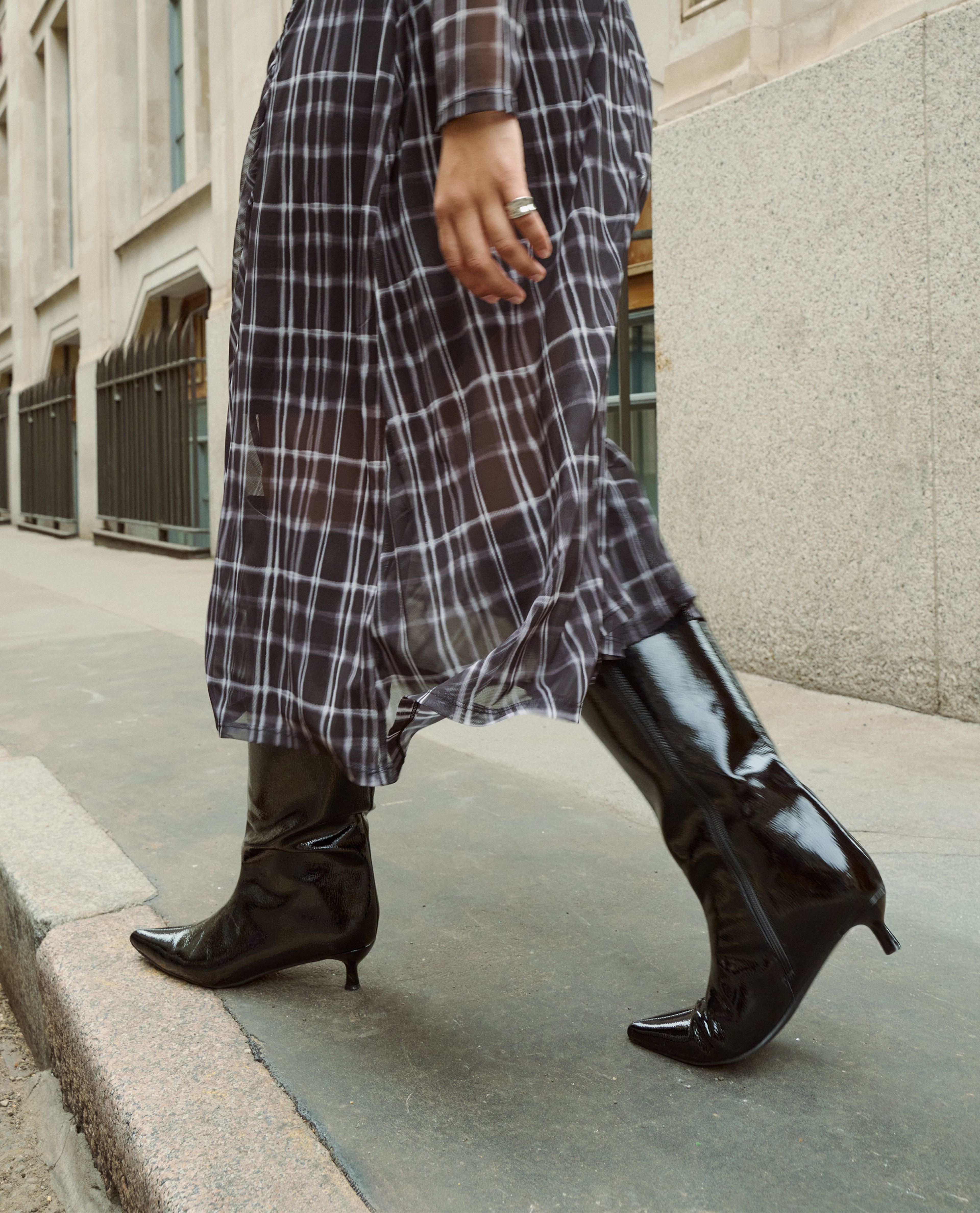 Model wears black patent boots