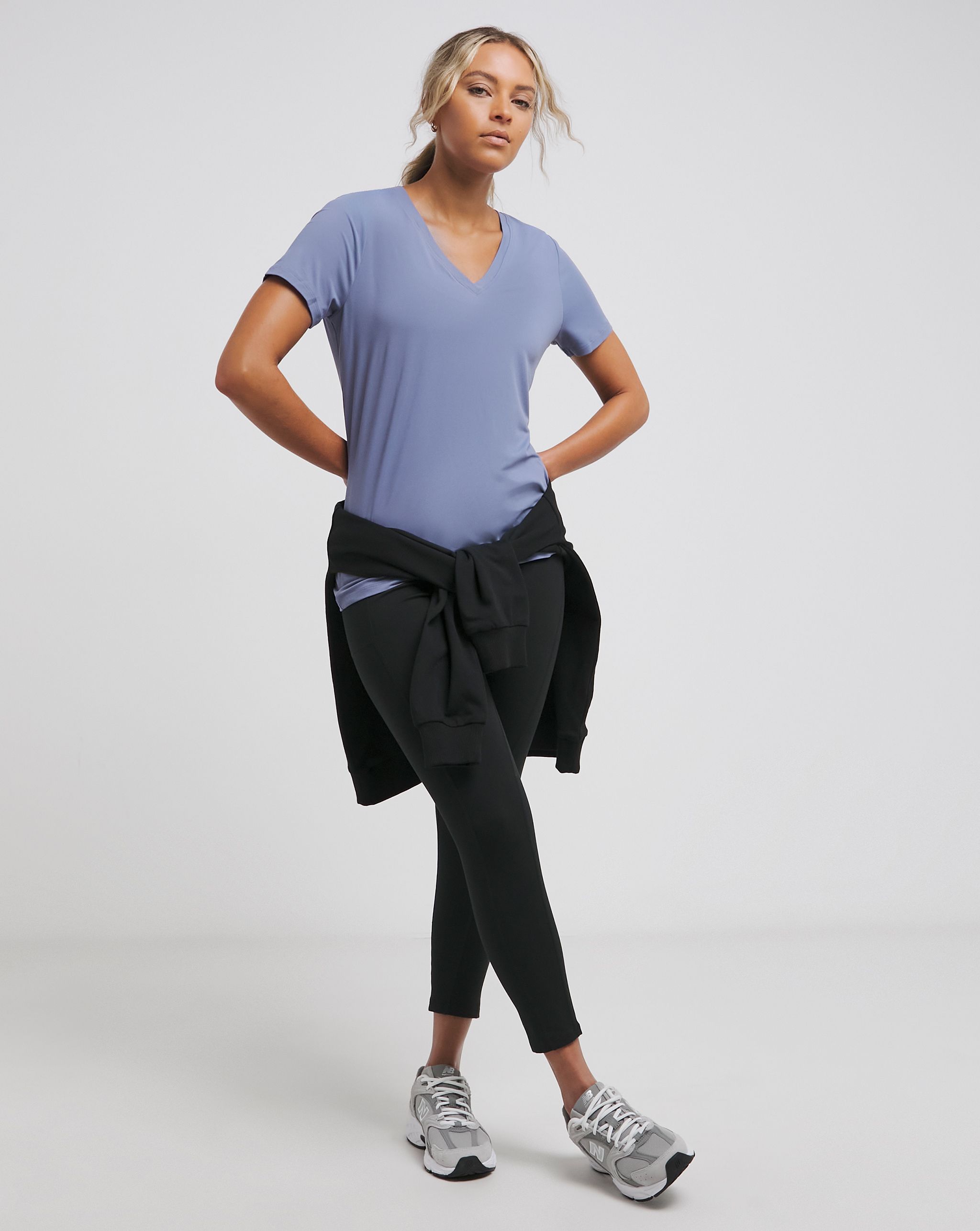 Model wears Skechers top and leggings