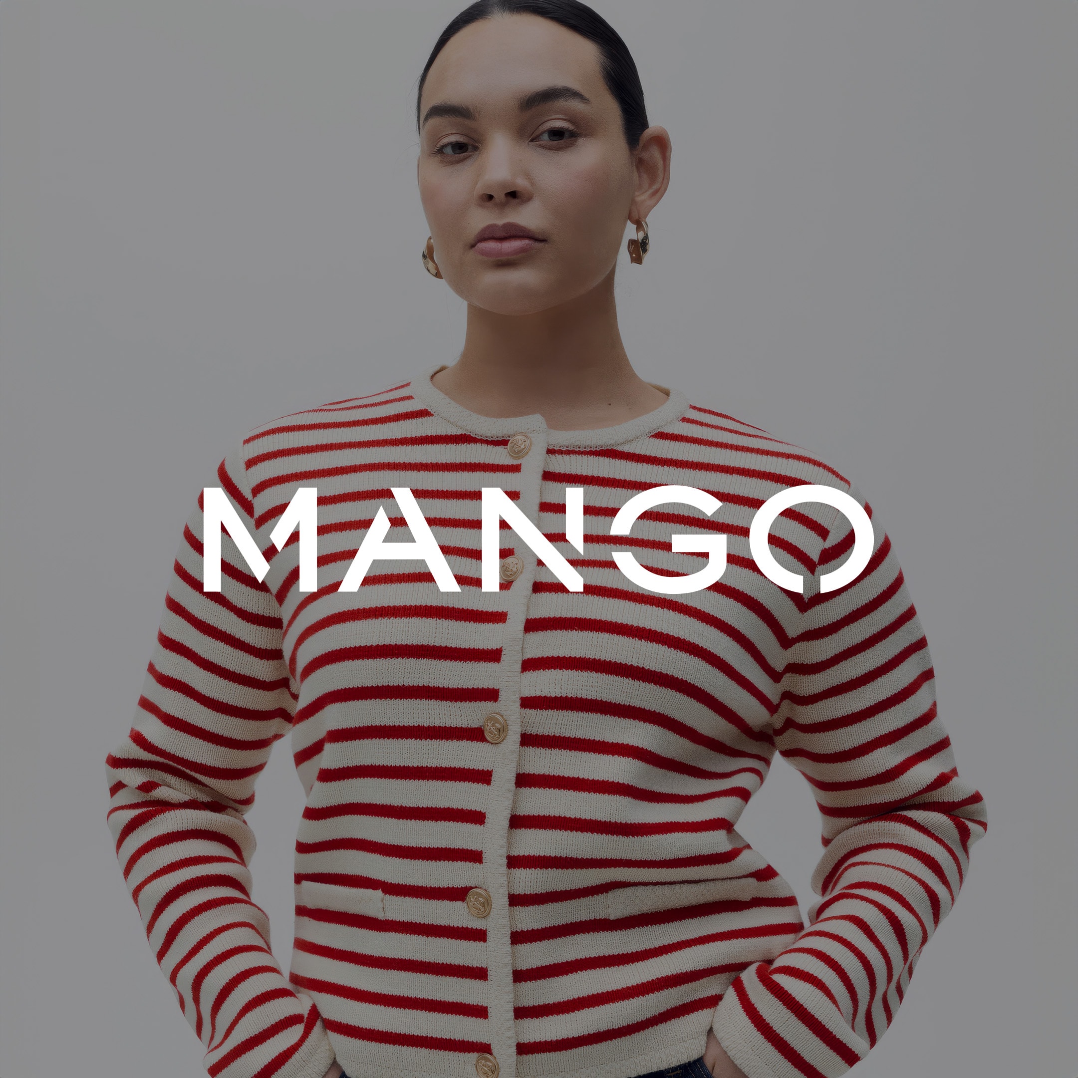Model wearing a red and white striped Mango cardigan