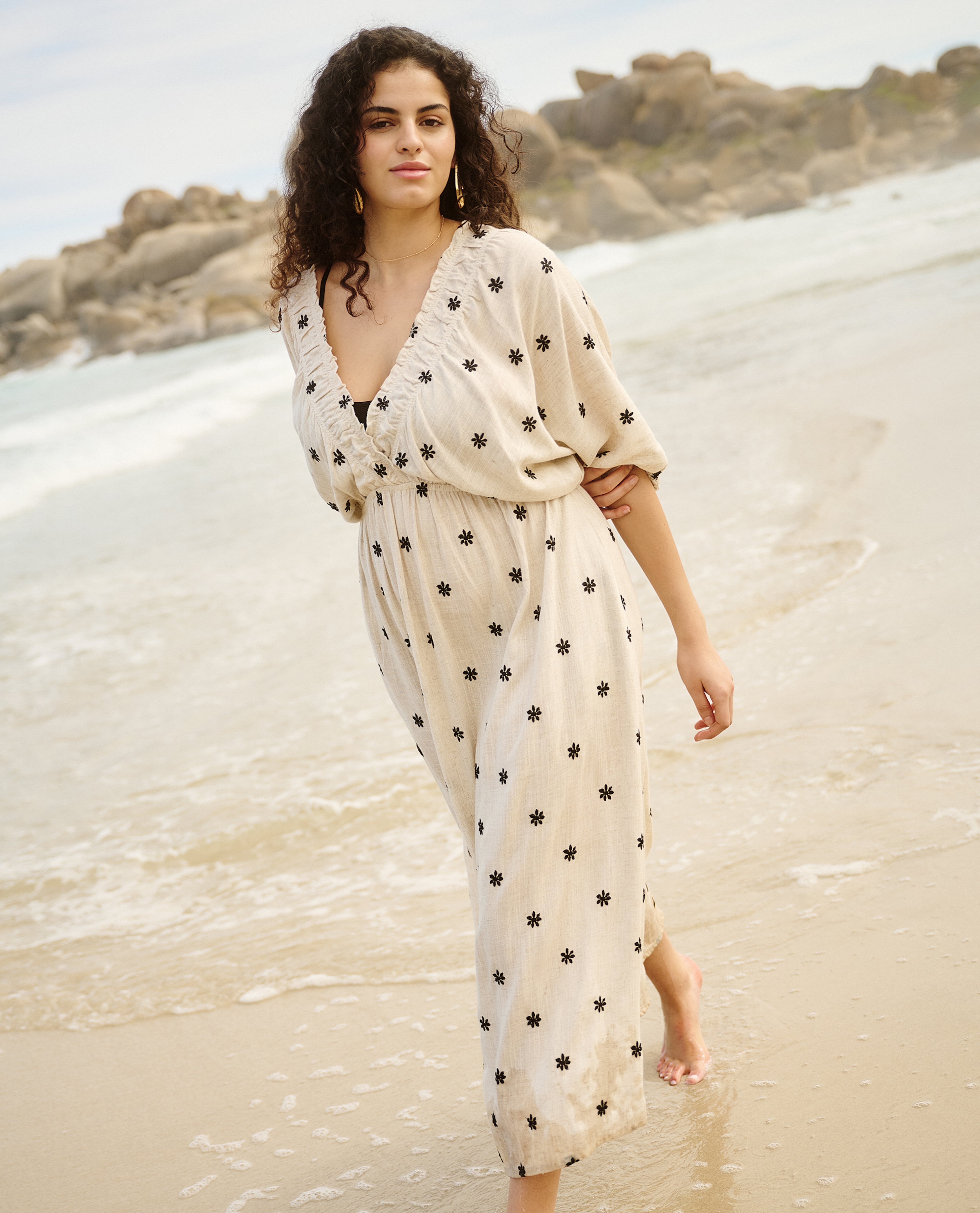Model wears polka-dot beach maxi-dress