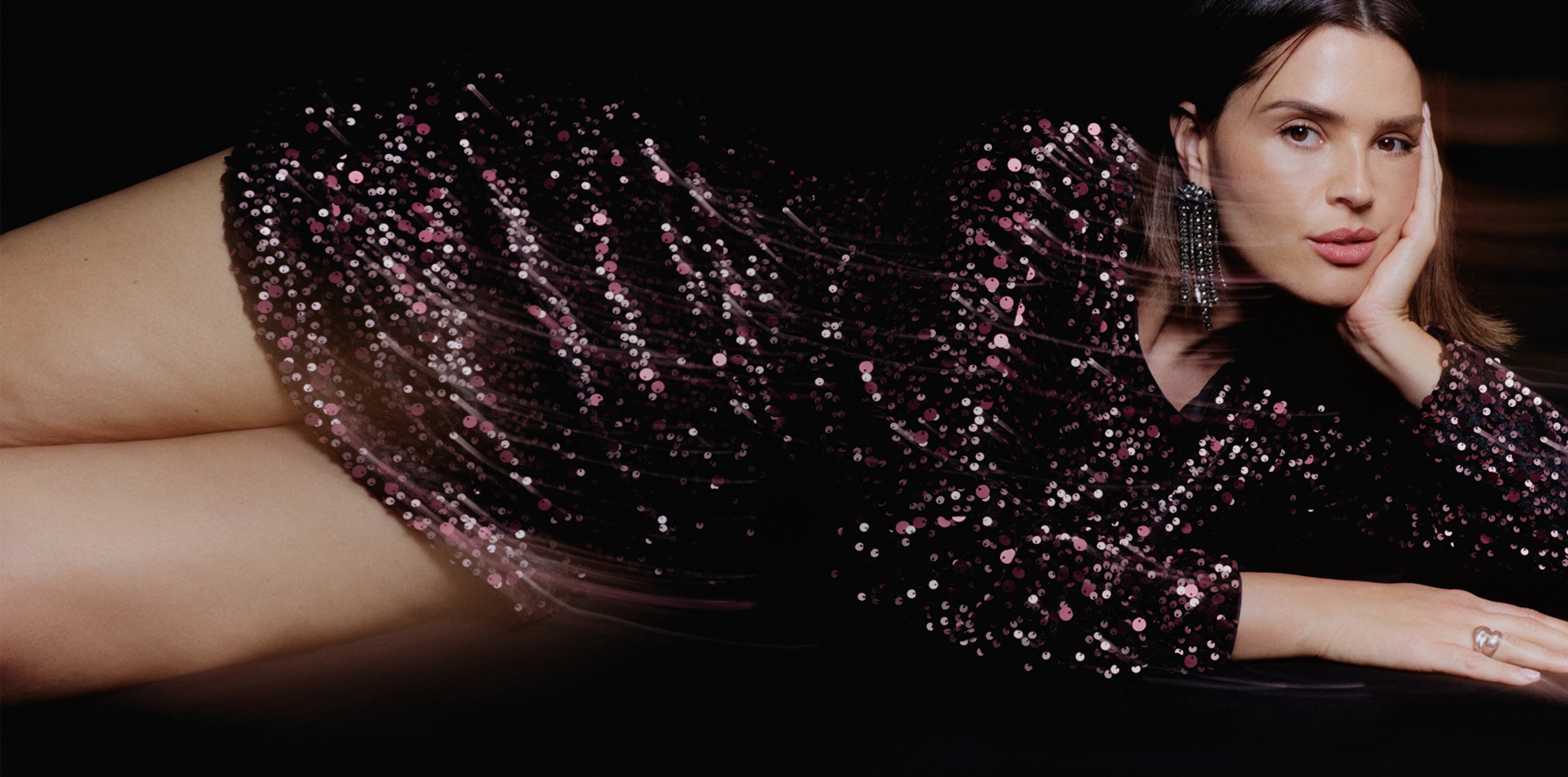 Model wears sparkly party dress