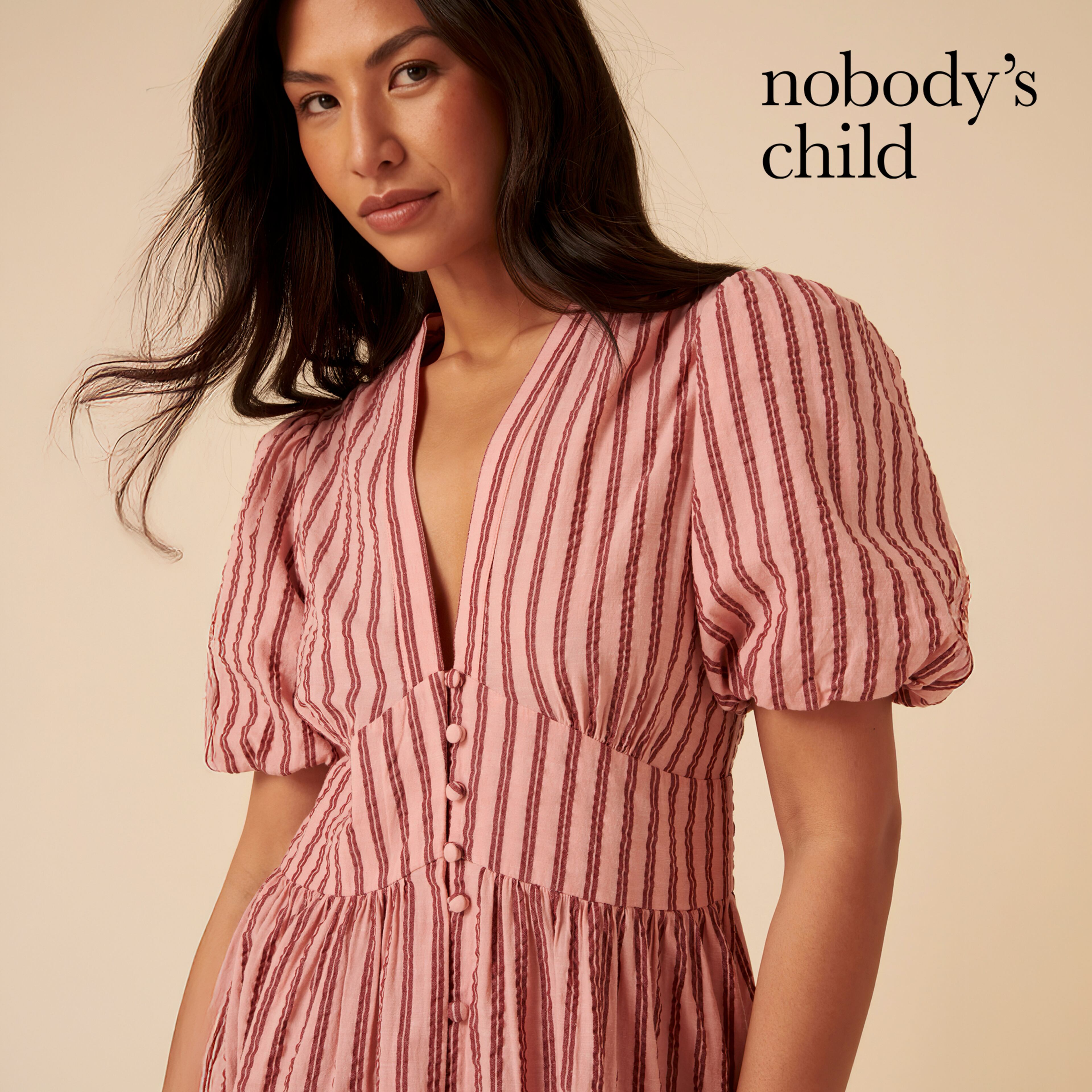 Model wears striped dress from Nobodys Child