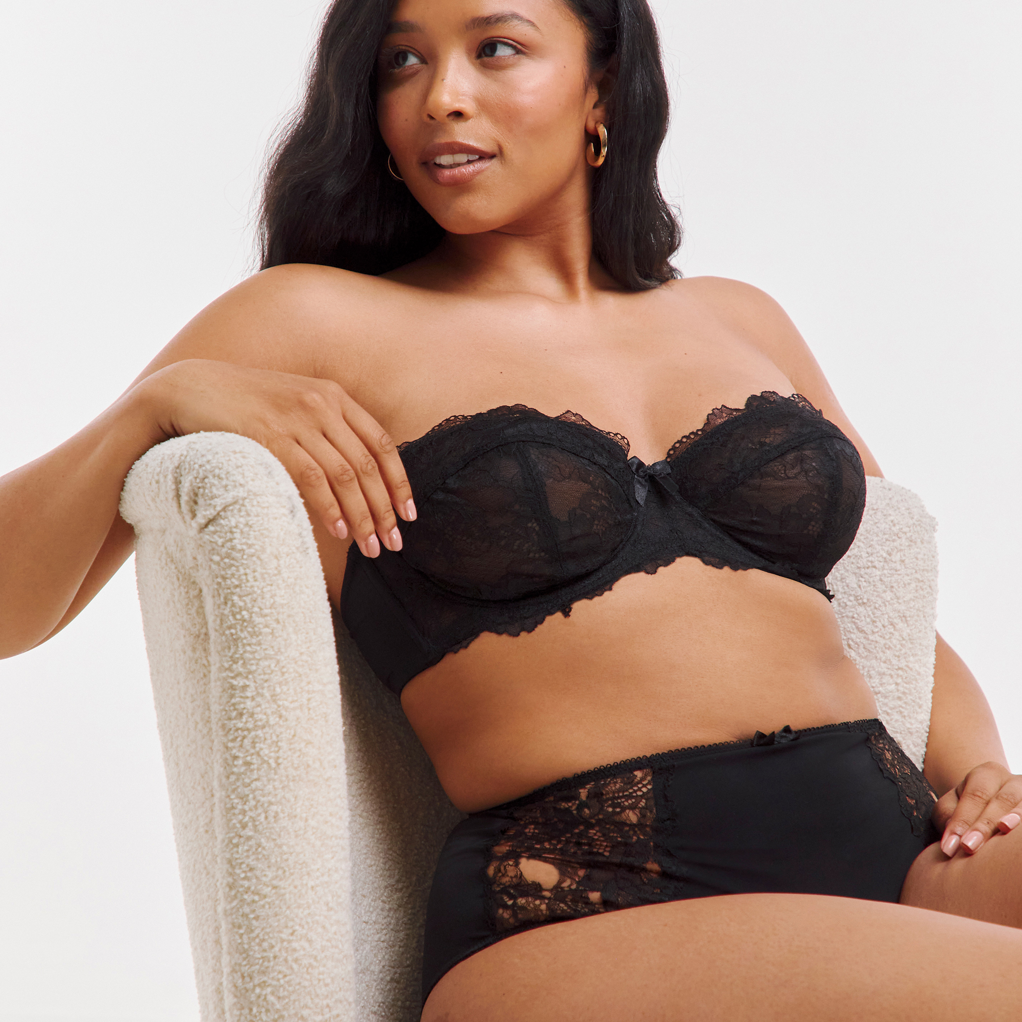 Model wearing a black strapless bra