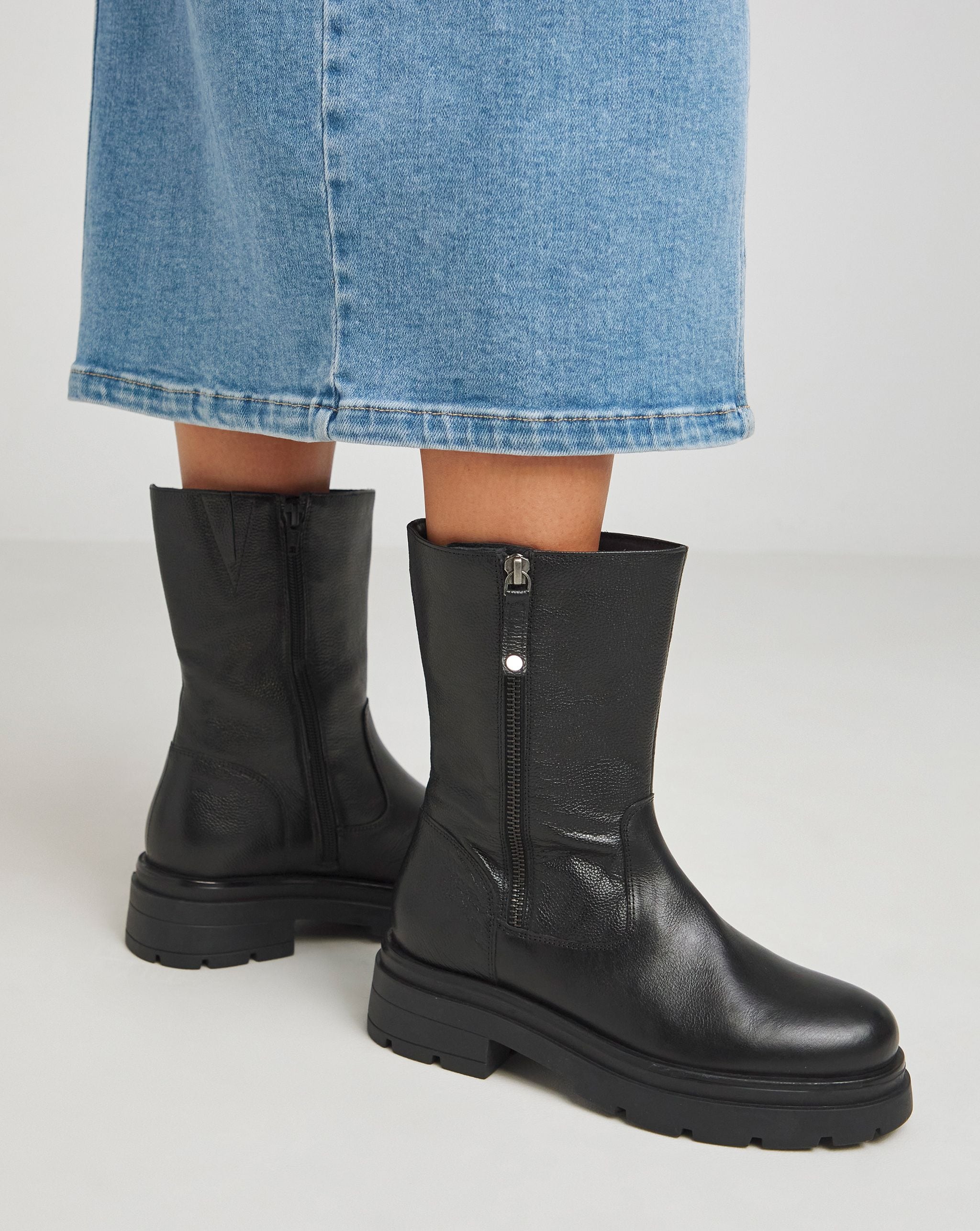 A pair of calf length chunky boots